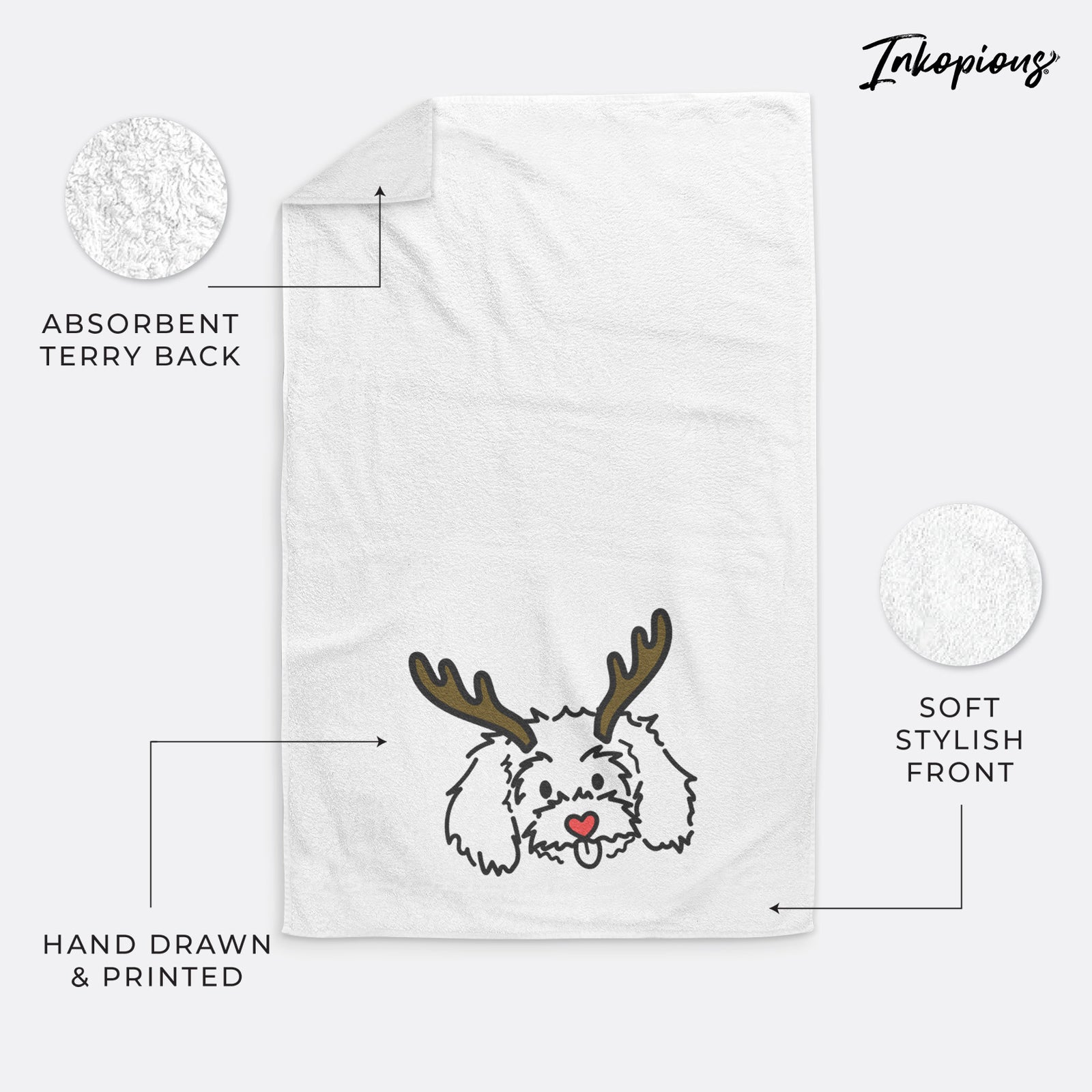 Minimalist line drawing of Holly the Maltipoo with reindeer antlers and a red nose on a decorative hand towel