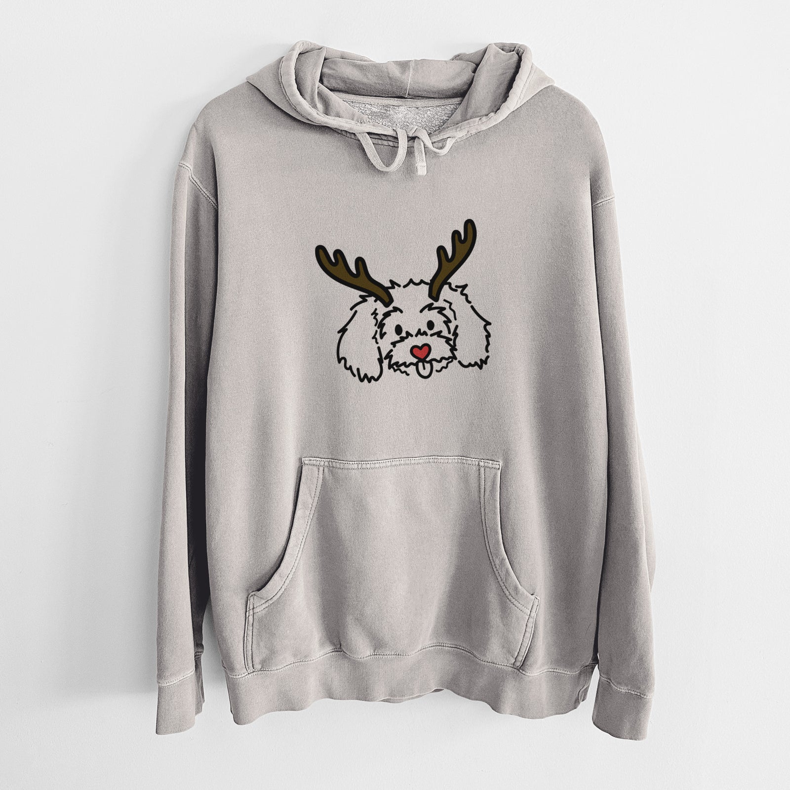 Minimalist line drawing of Holly the Maltipoo with reindeer antlers and a red nose on a Cement Unisex pigment dyed hoodie