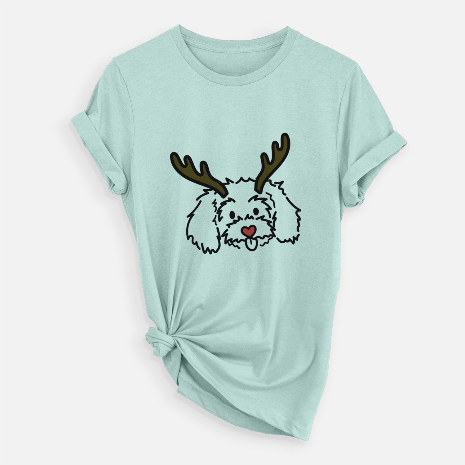 Minimalist line drawing of Holly the Maltipoo with reindeer antlers and a red nose on a Heather Sage Unisex crewneck