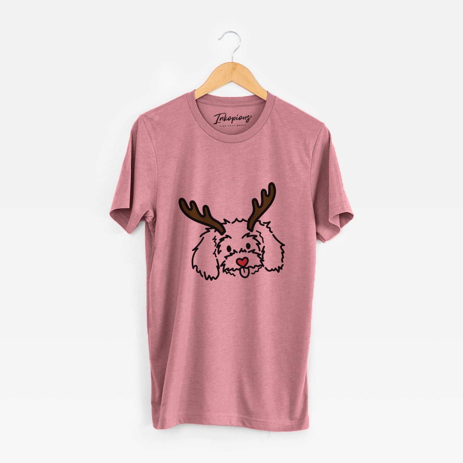 Minimalist line drawing of Holly the Maltipoo with reindeer antlers and a red nose on a Mauve Unisex crewneck