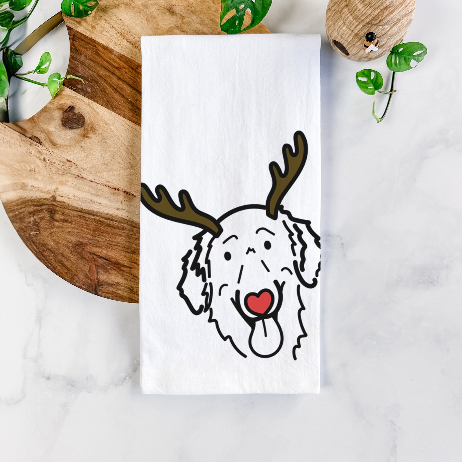 Minimalist line drawing of Jack the Flat-Coated Retriever with reindeer antlers and a red nose on a tea towel