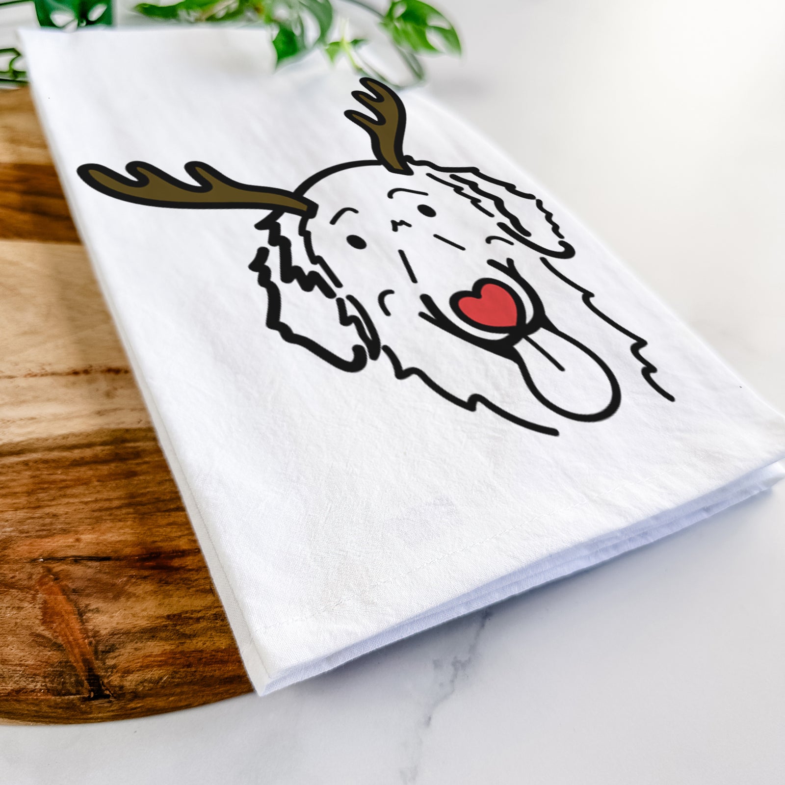 Minimalist line drawing of Jack the Flat-Coated Retriever with reindeer antlers and a red nose on a tea towel