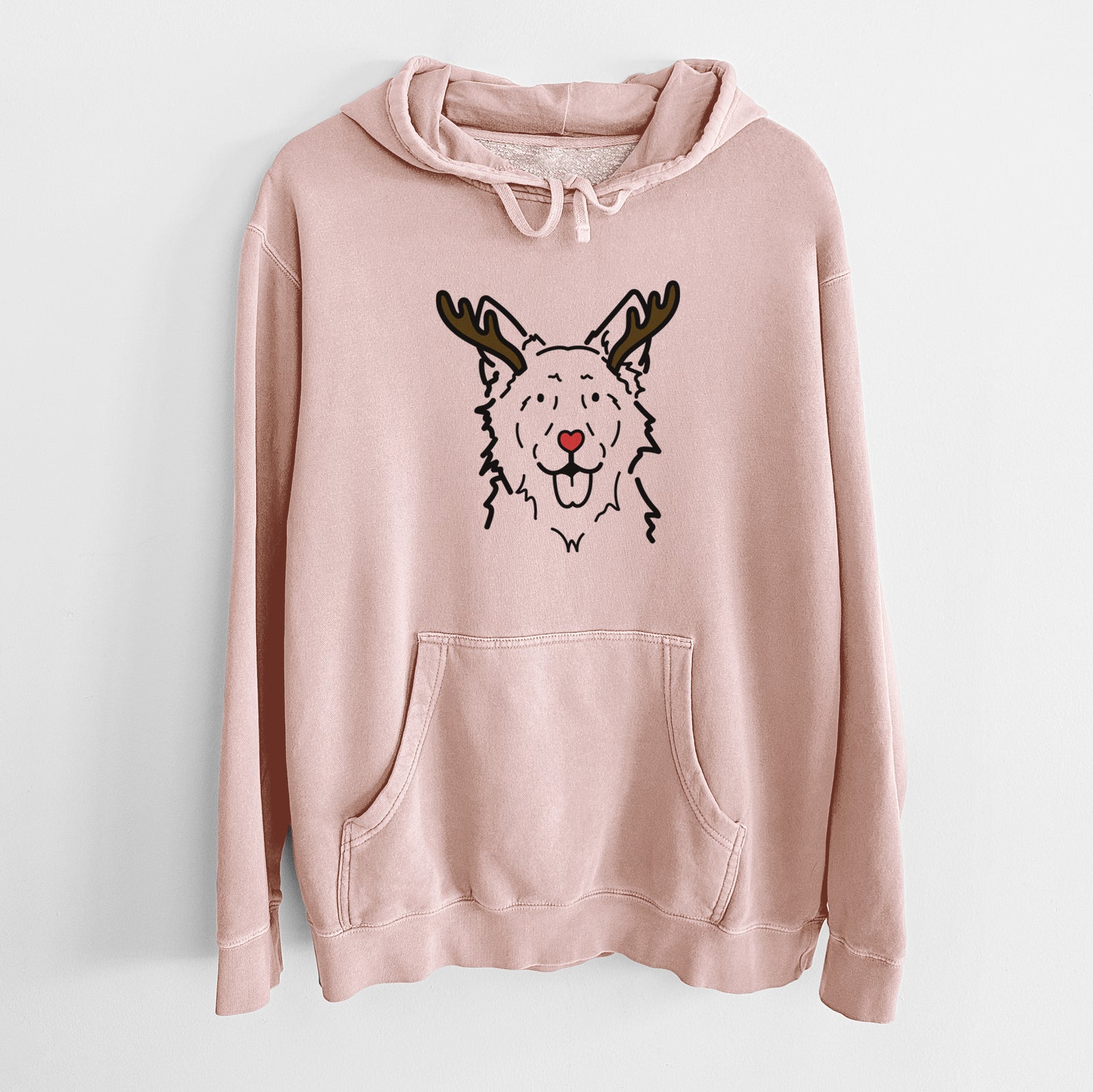 Minimalist line drawing of Jack the Mudi with reindeer antlers and a red nose on a Dusty Pink Unisex pigment dyed hoodie