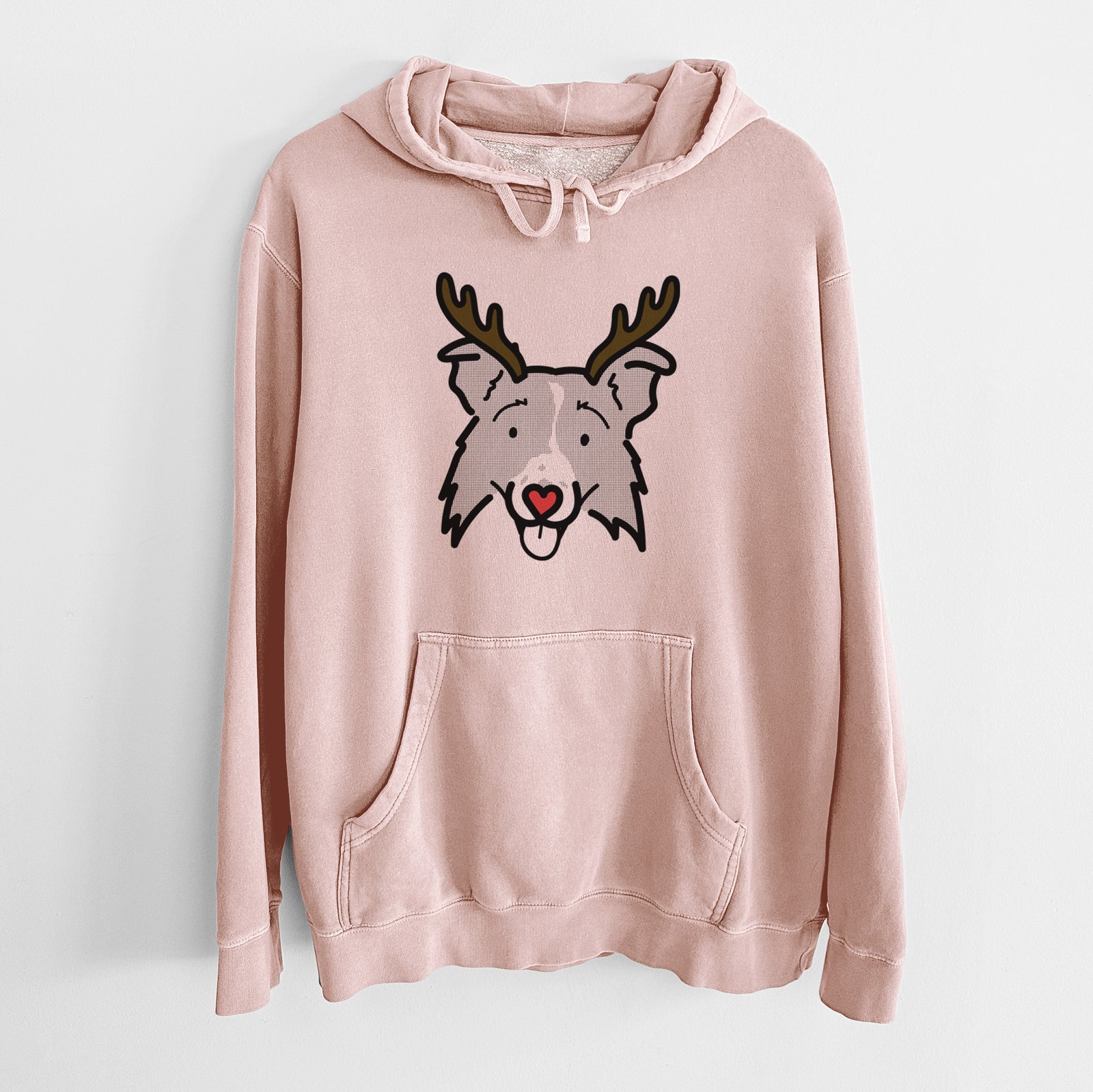 Minimalist line drawing of Jam the Border Collie 2.0 with reindeer antlers and a red nose on a Dusty Pink Unisex pigment dyed hoodie