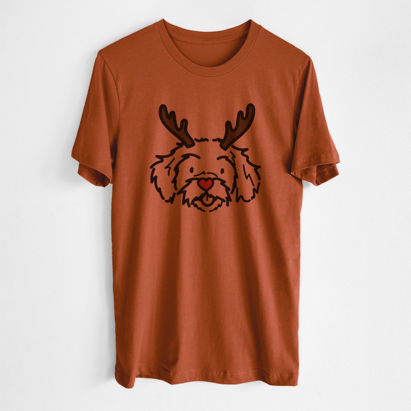 Minimalist line drawing of Jo Jo the Peekapoo with reindeer antlers and a red nose on an Autumn Unisex crewneck, worn by a man