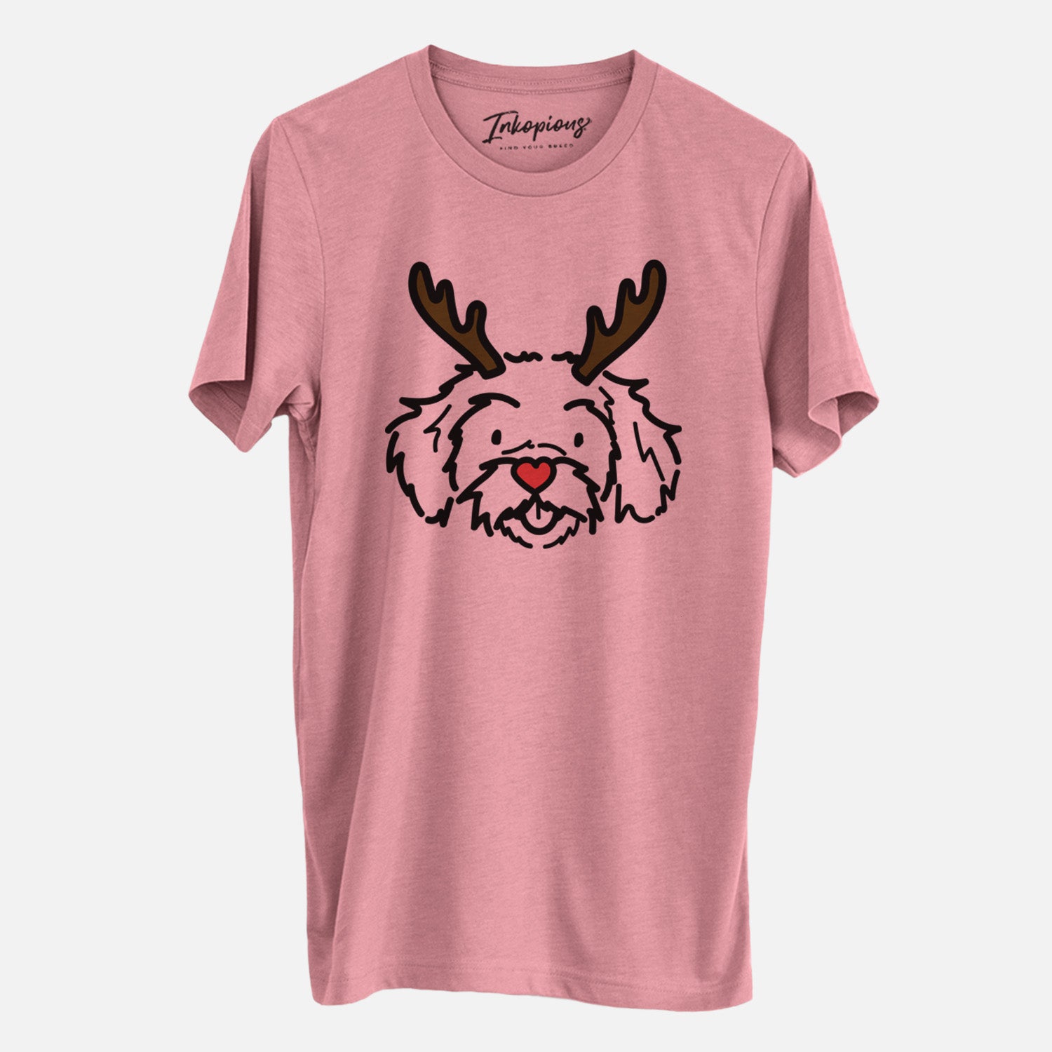 Minimalist line drawing of Jo Jo the Peekapoo with reindeer antlers and a red nose on a Mauve Unisex crewneck, worn by a man