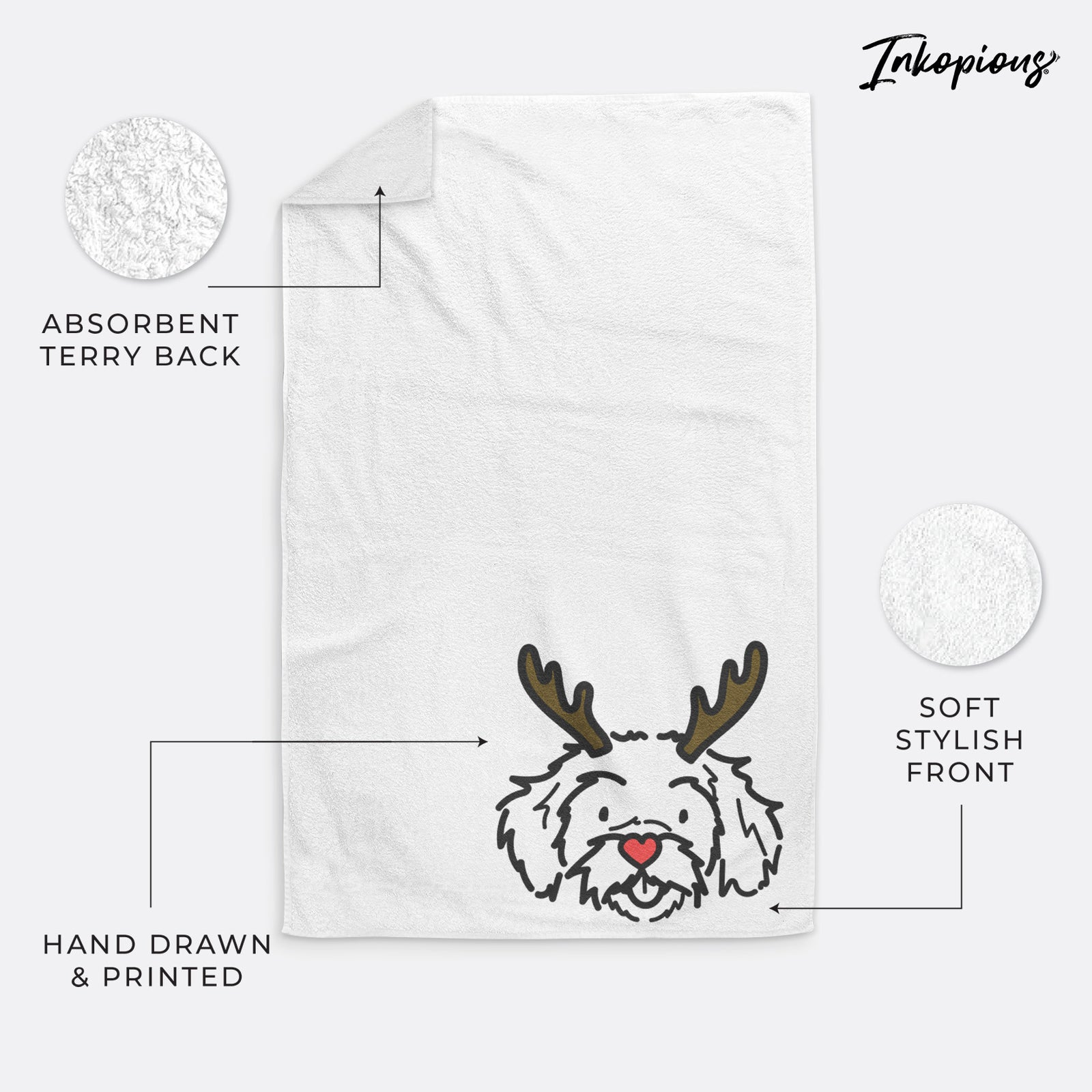 Minimalist line drawing of Jo Jo the Peekapoo with reindeer antlers and a red nose on a hand towel