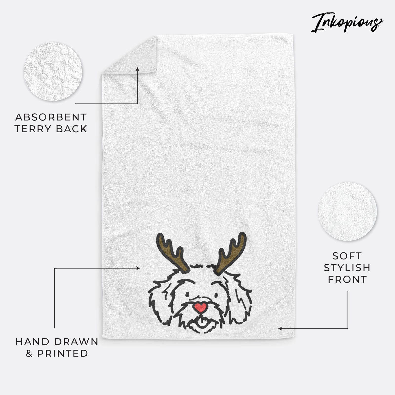 Minimalist line drawing of Jo Jo the Peekapoo with reindeer antlers and a red nose on a hand towel