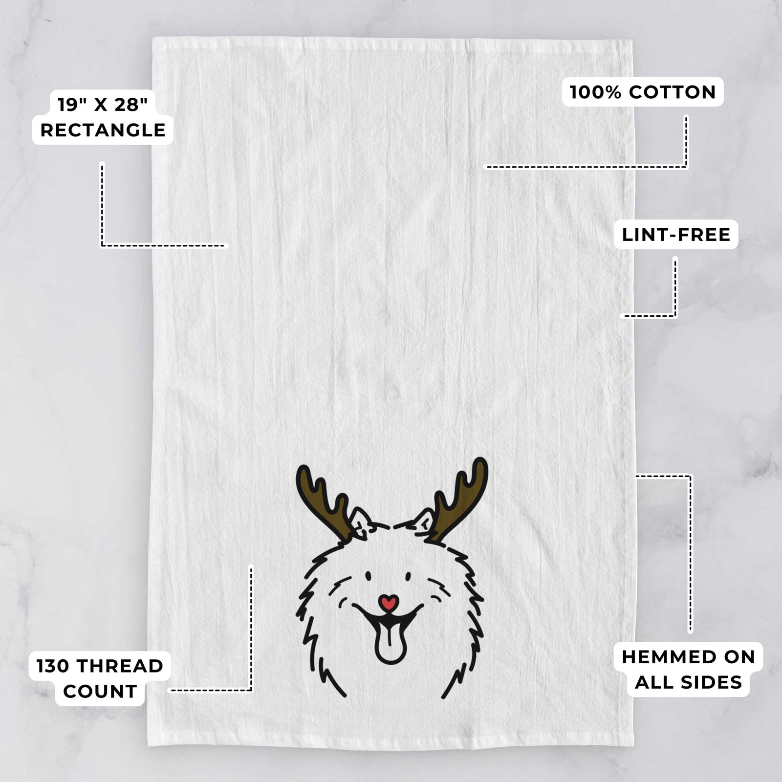 Minimalist line drawing of Johnny the Samoyed with reindeer antlers and a red nose on a tea towel, with feature callouts: 19 x 28 inch rectangle, 100% cotton, lint-free, 120 thread count, hemmed on all sides