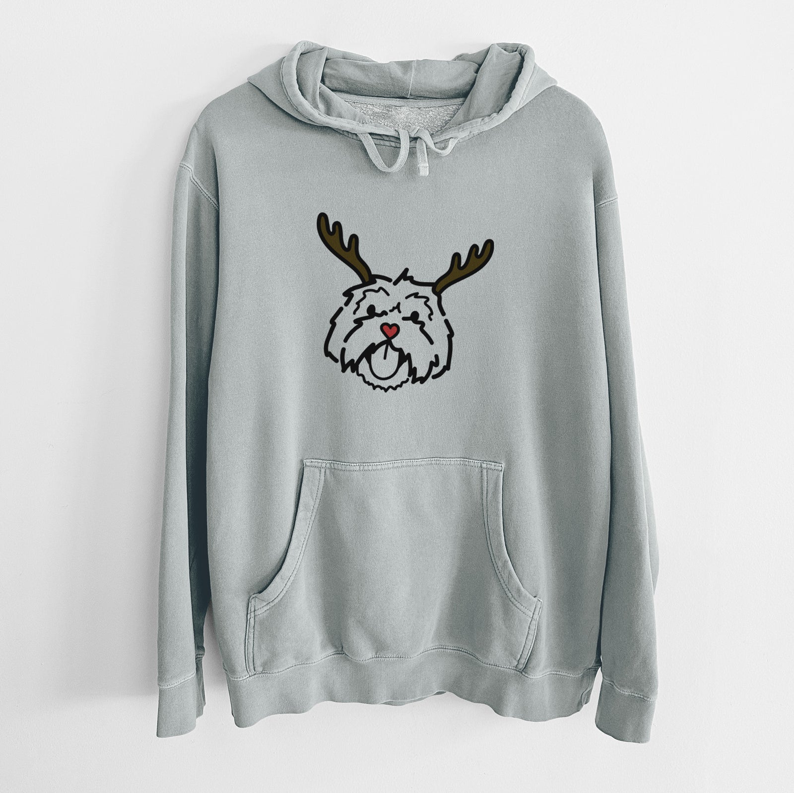 Minimalist line drawing of Keia the Lhasa Apso with reindeer antlers and a red nose on a Sage Unisex pigment dyed hoodie