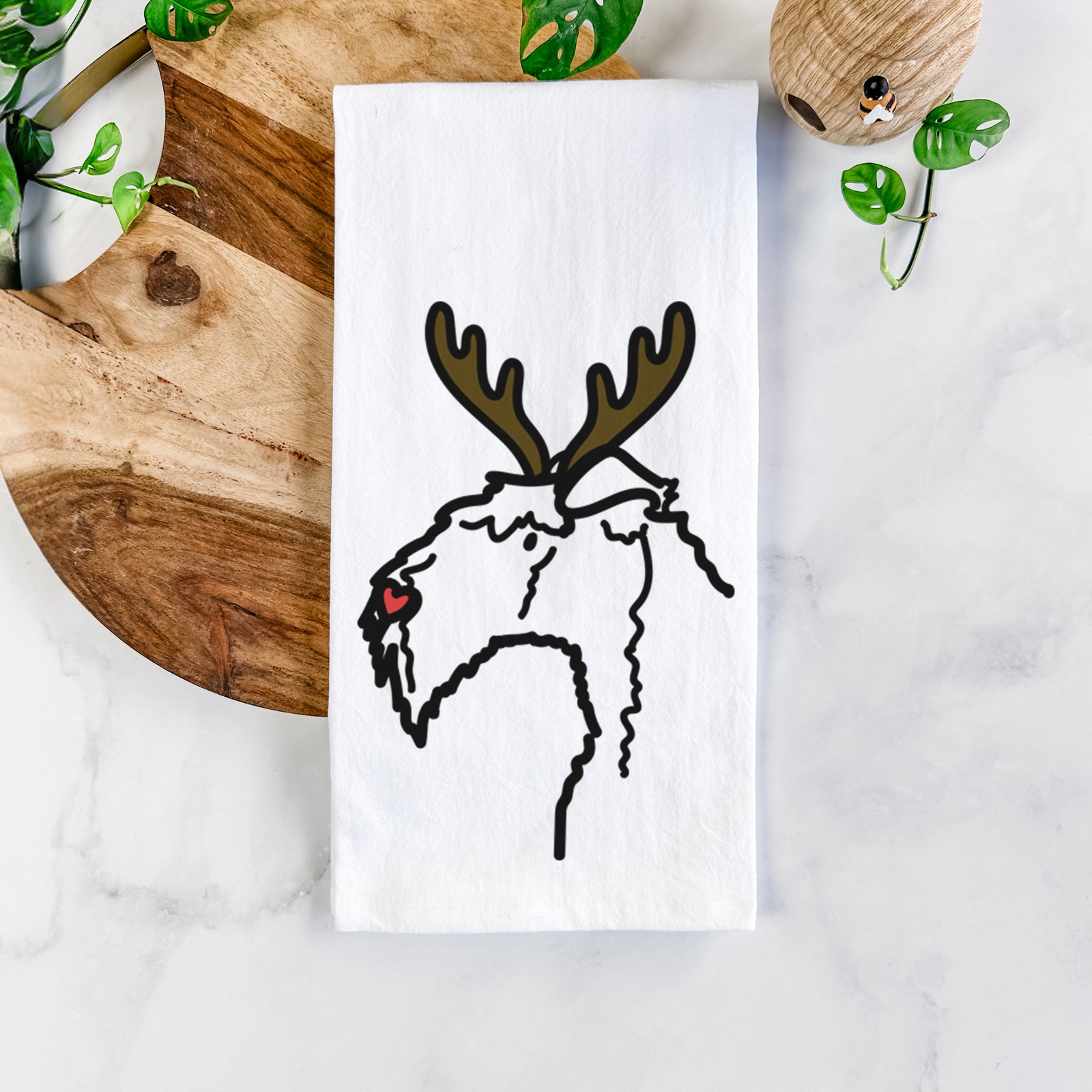 Minimalist line drawing of a Kerry Blue Terrier with reindeer antlers and a red nose on a tea towel