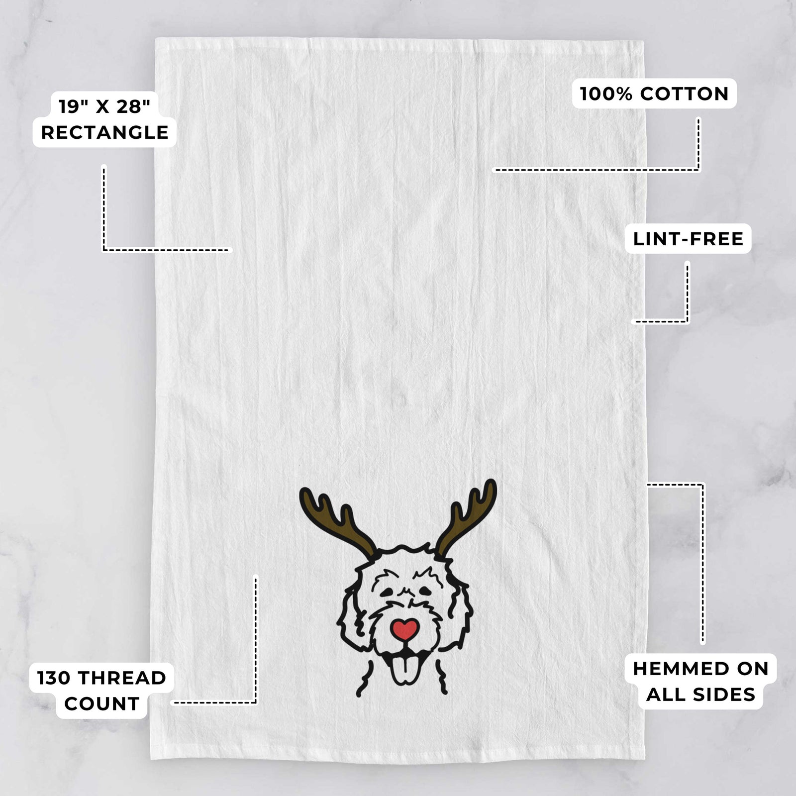 Minimalist line drawing of a Labradoodle with reindeer antlers and a red nose on a tea towel, with feature callouts: 19 x 28 inch rectangle, 100% cotton, lint-free, 120 thread count, hemmed on all sides