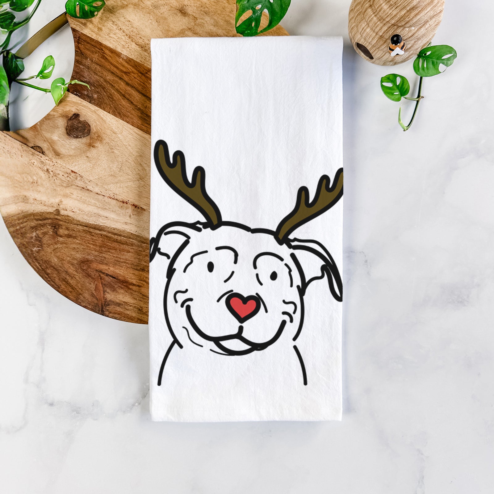 Minimalist line drawing of Lady the American Pitbull Terrier with reindeer antlers and a red nose on a tea towel