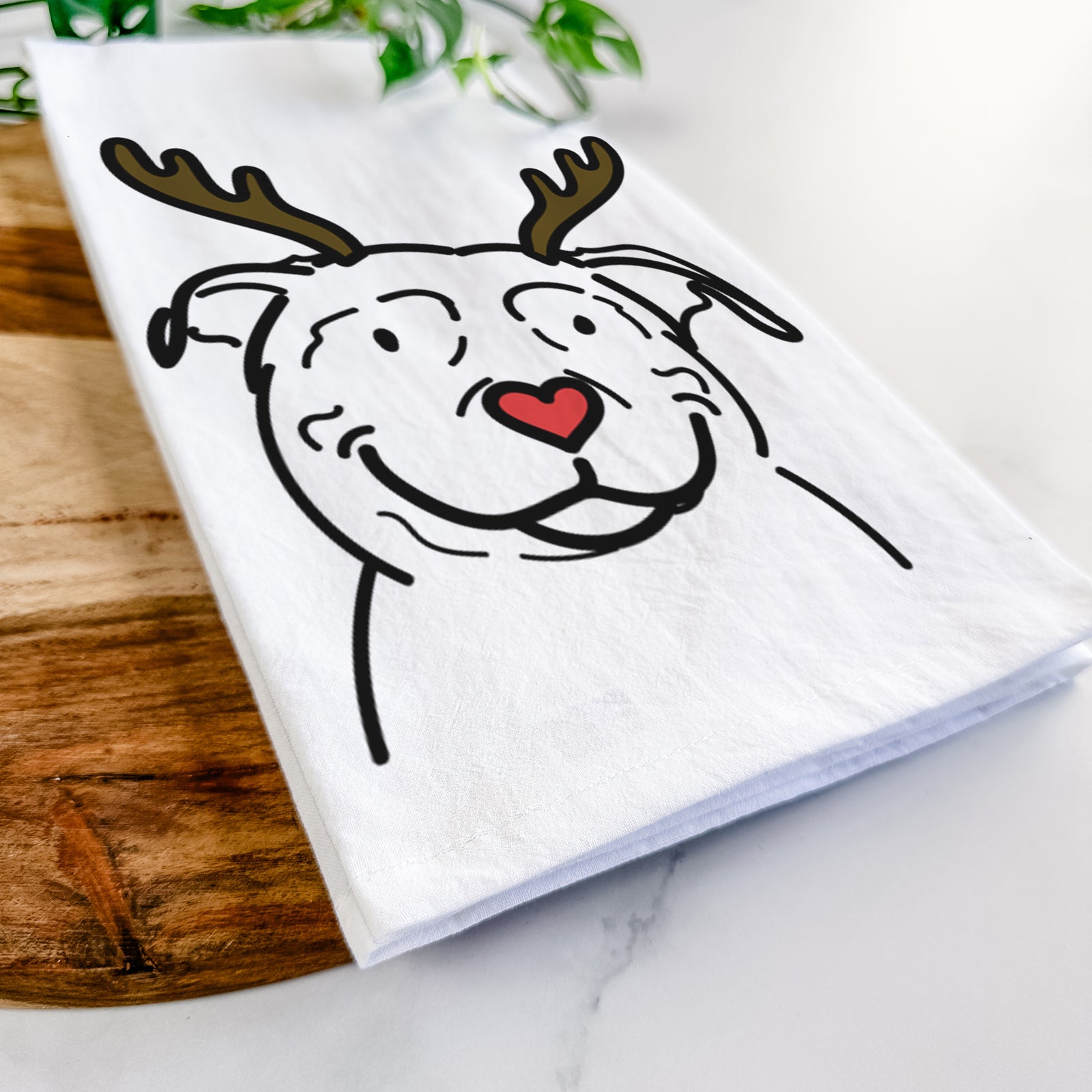 Minimalist line drawing of Lady the American Pitbull Terrier with reindeer antlers and a red nose on a tea towel