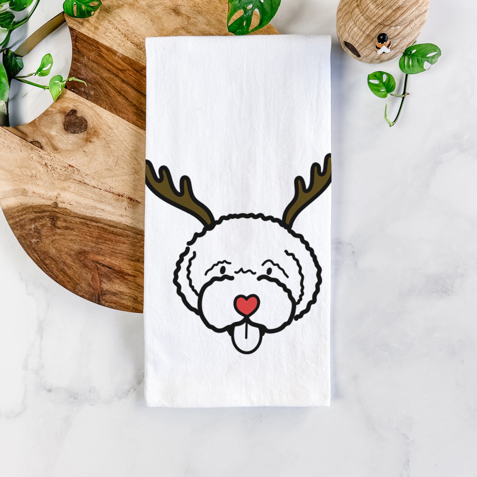 Minimalist line drawing of a Lagotta Romagnolo with reindeer antlers and a red nose on a tea towel
