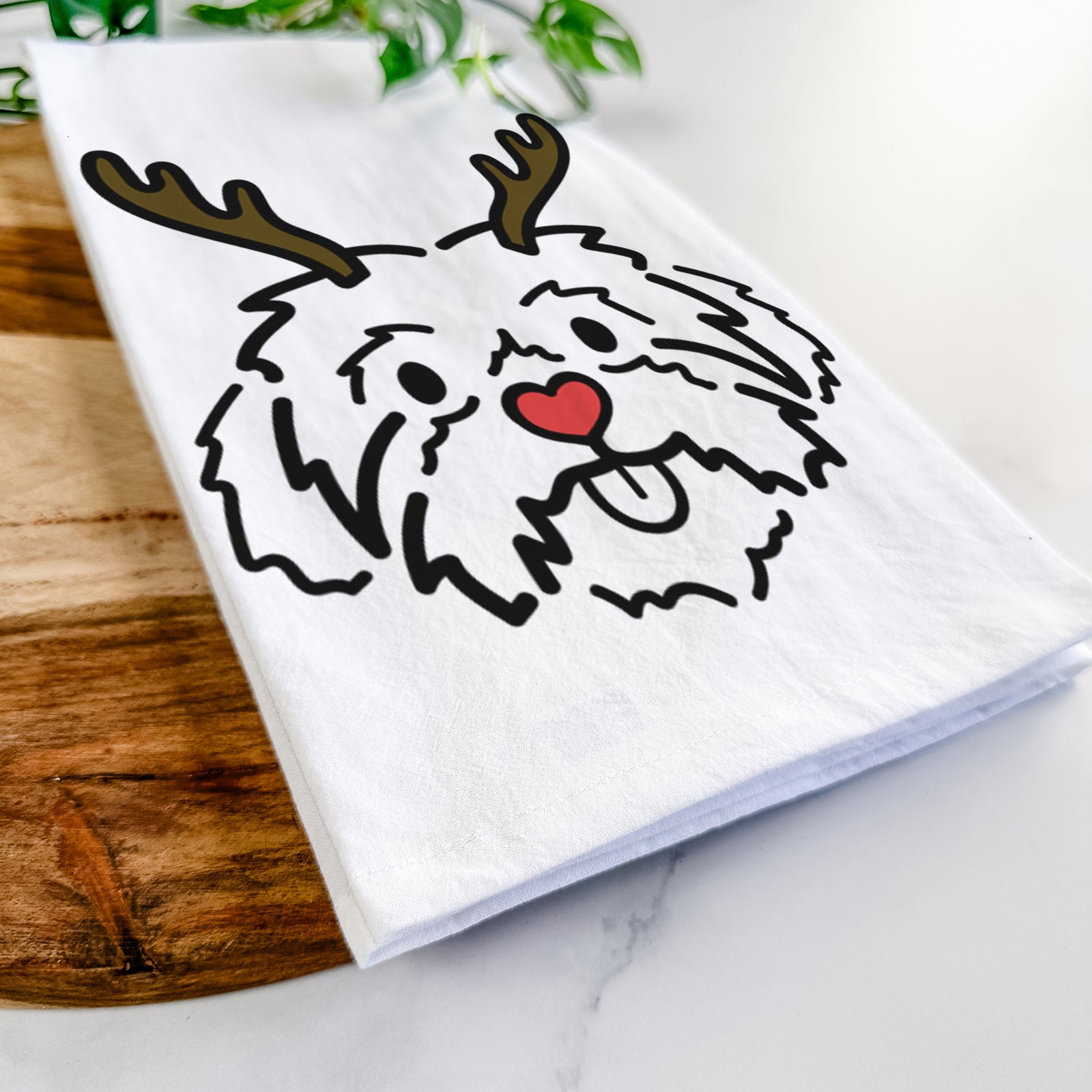 Minimalist line drawing of Leo the Shih Tzu with reindeer antlers and a red nose on a tea towel