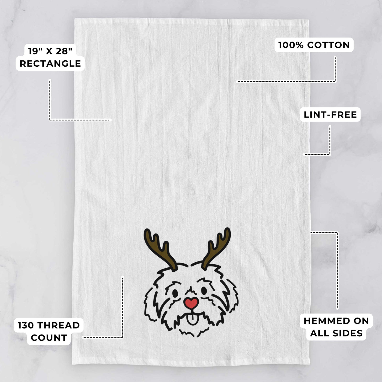Minimalist line drawing of Leo the Shih Tzu with reindeer antlers and a red nose on a tea towel, with feature callouts: 19 x 28 inch rectangle, 100% cotton, lint-free, 120 thread count, hemmed on all sides