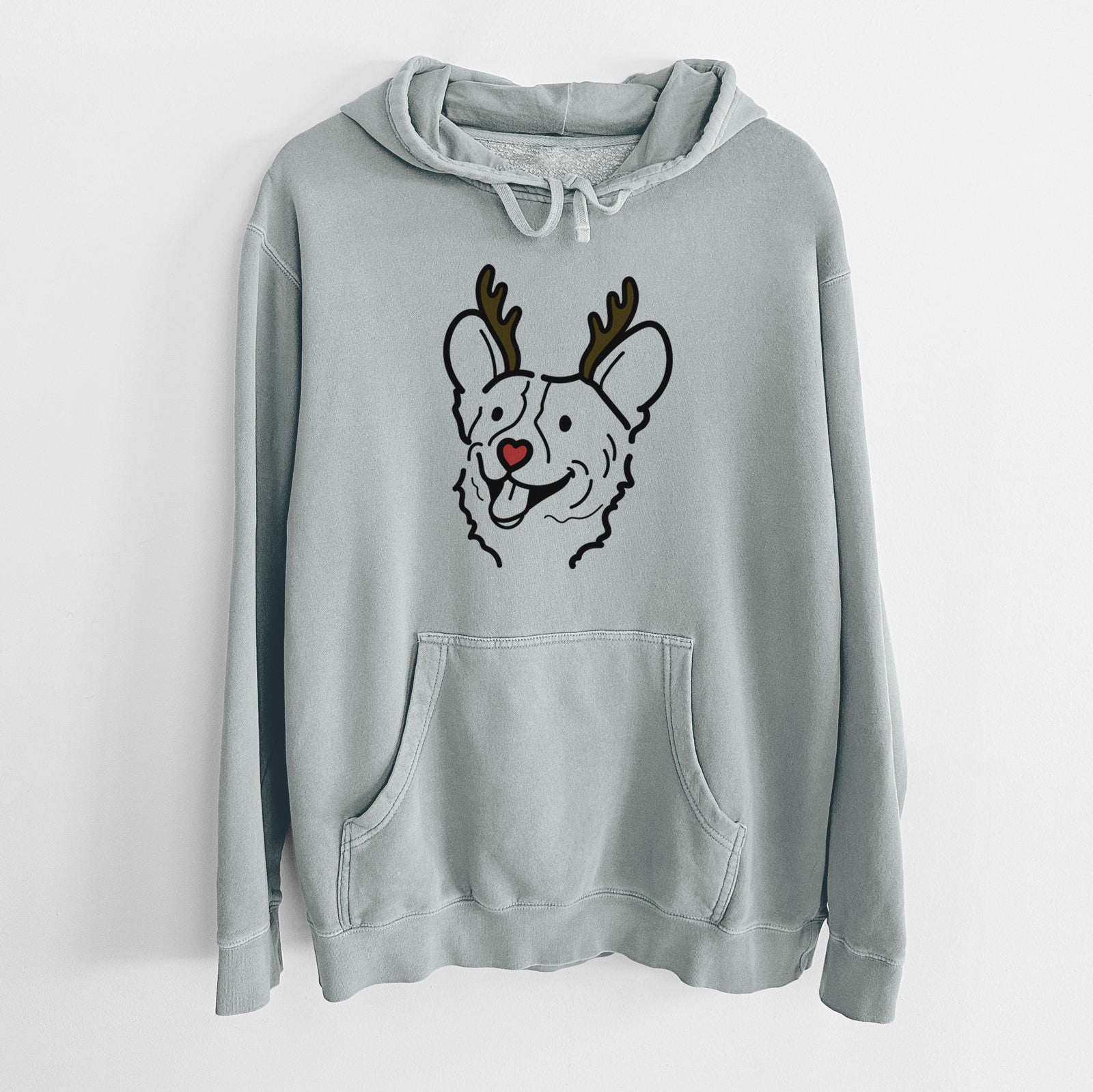 Minimalist line drawing of Lily the Corgi with reindeer antlers and a red nose on a Sage Unisex pigment dyed hoodie