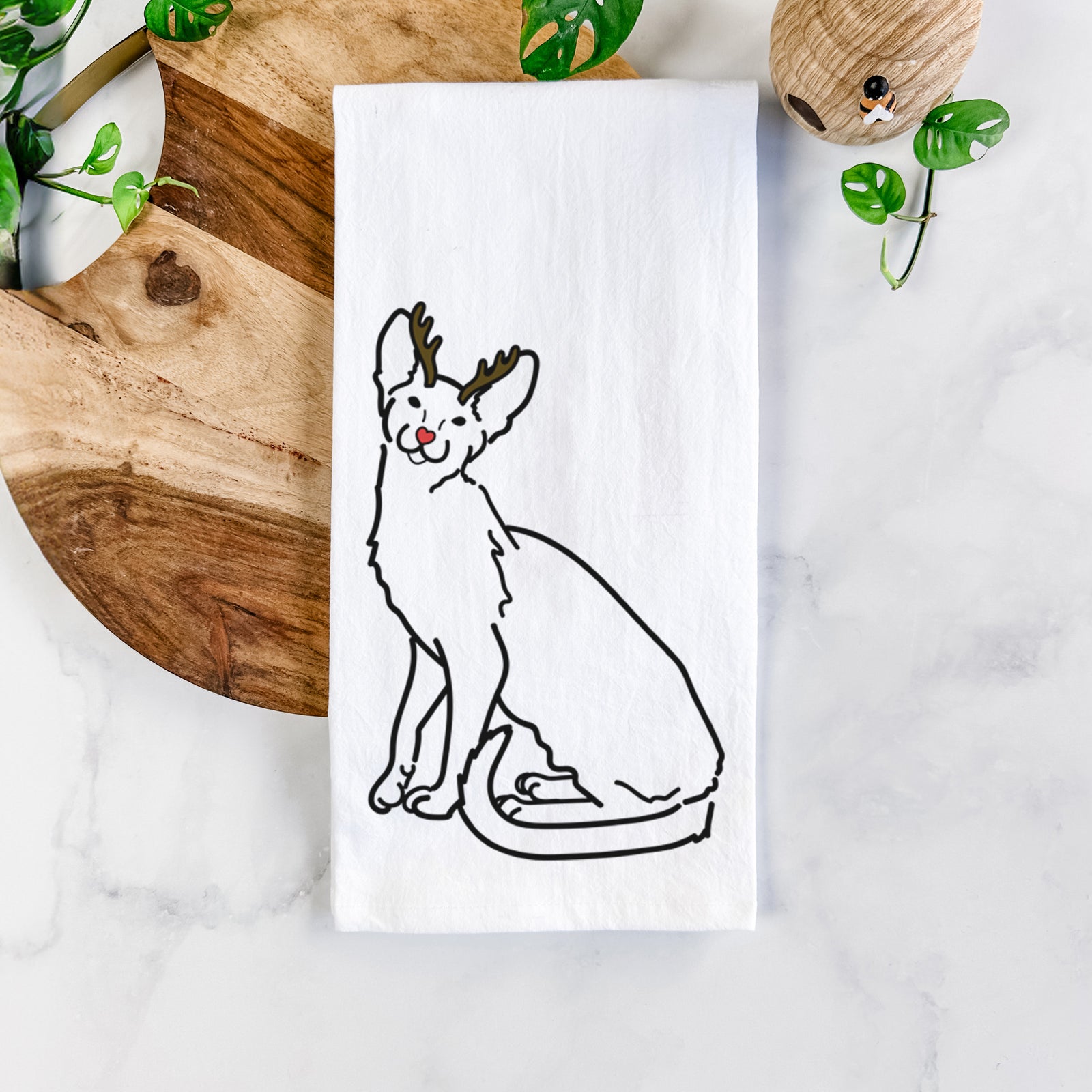 Minimalist line drawing of Lyra the Oriental Shorthair Cat with reindeer antlers and a red nose on a tea towel