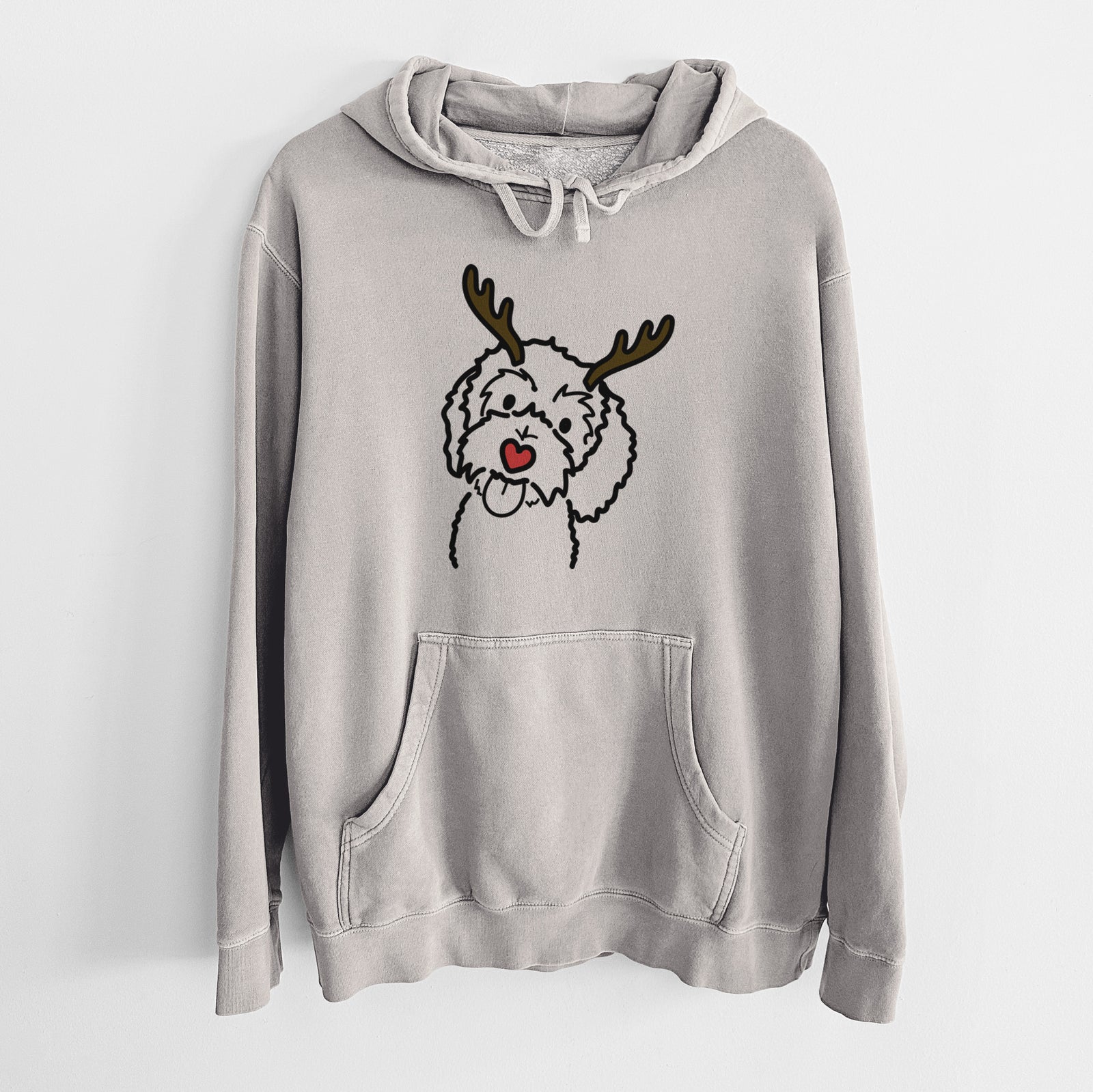 Minimalist line drawing of Mabel the Bernedoodle with reindeer antlers and a red nose on a Cement Unisex pigment dyed hoodie