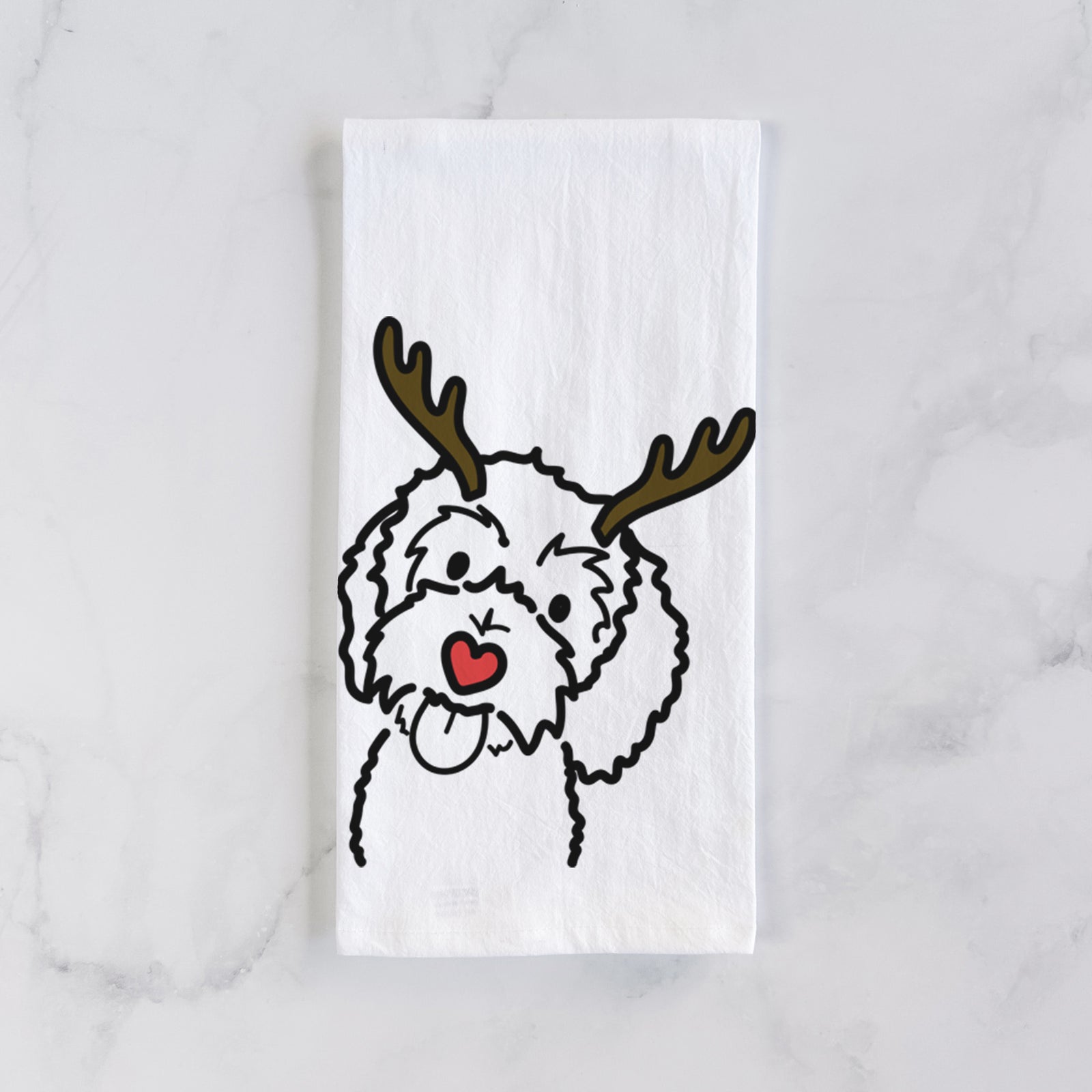 Minimalist line drawing of Mabel the Bernedoodle with reindeer antlers and a red nose on a tea towel