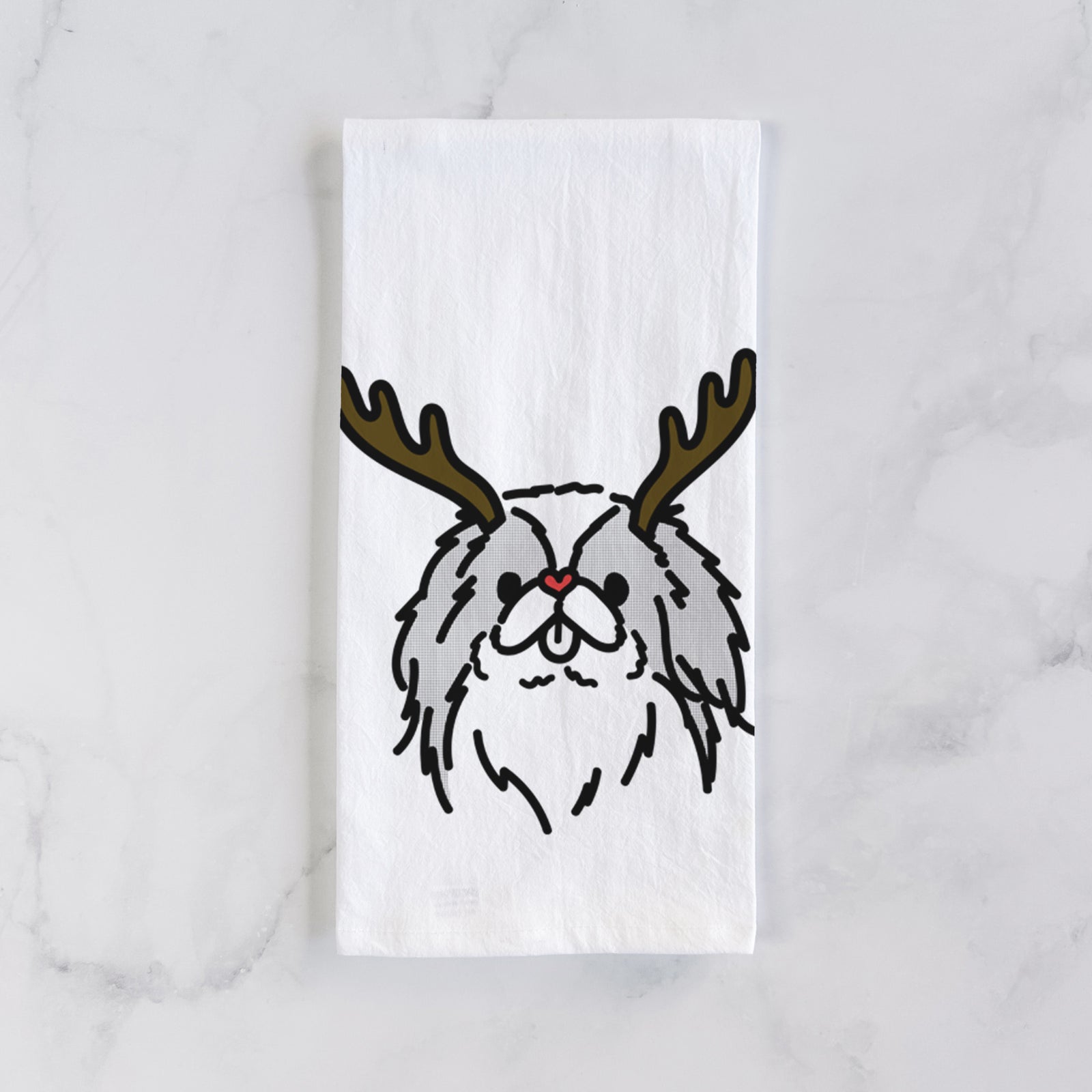 Minimalist line drawing of Macha the Japanese Chin with reindeer antlers and a red nose on a tea towel