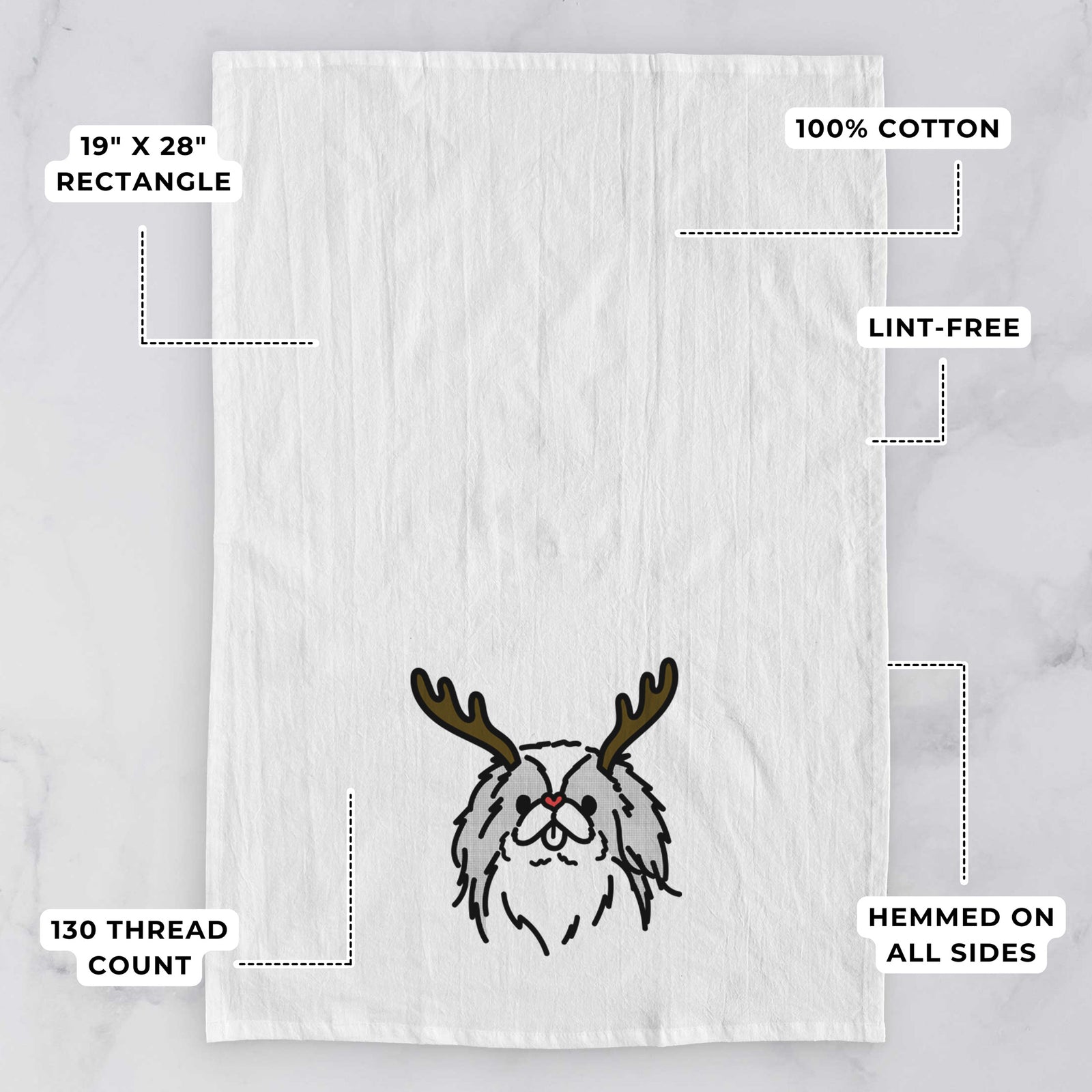 Minimalist line drawing of Macha the Japanese Chin with reindeer antlers and a red nose on a tea towel, with feature callouts: 19 x 28 inch rectangle, 100% cotton, lint-free, 120 thread count, hemmed on all sides