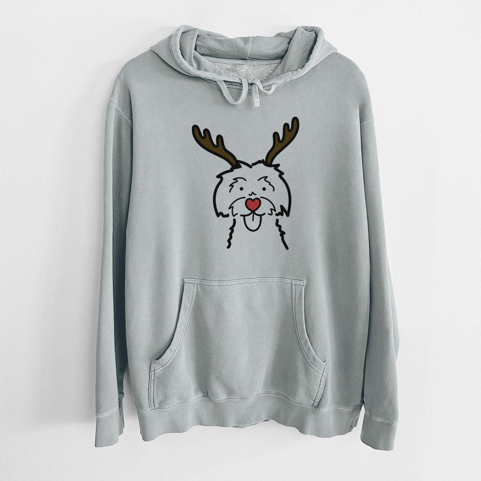 Minimalist line drawing of a Maltese with reindeer antlers and a red nose on a Sage Unisex pigment dyed hoodie