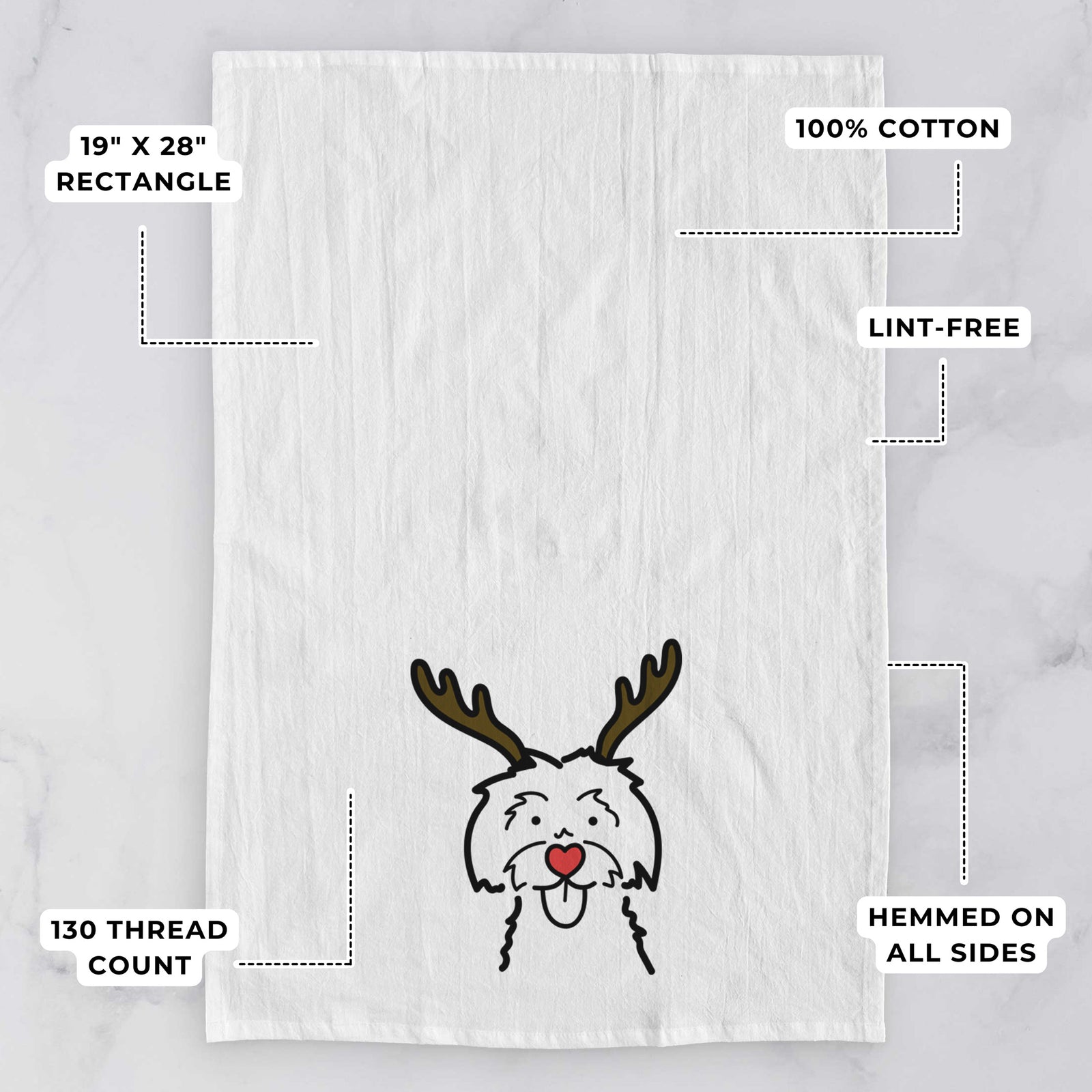 Minimalist line drawing of a Maltese with reindeer antlers and a red nose on a tea towel, with feature callouts: 19 x 28 inch rectangle, 100% cotton, lint-free, 120 thread count, hemmed on all sides