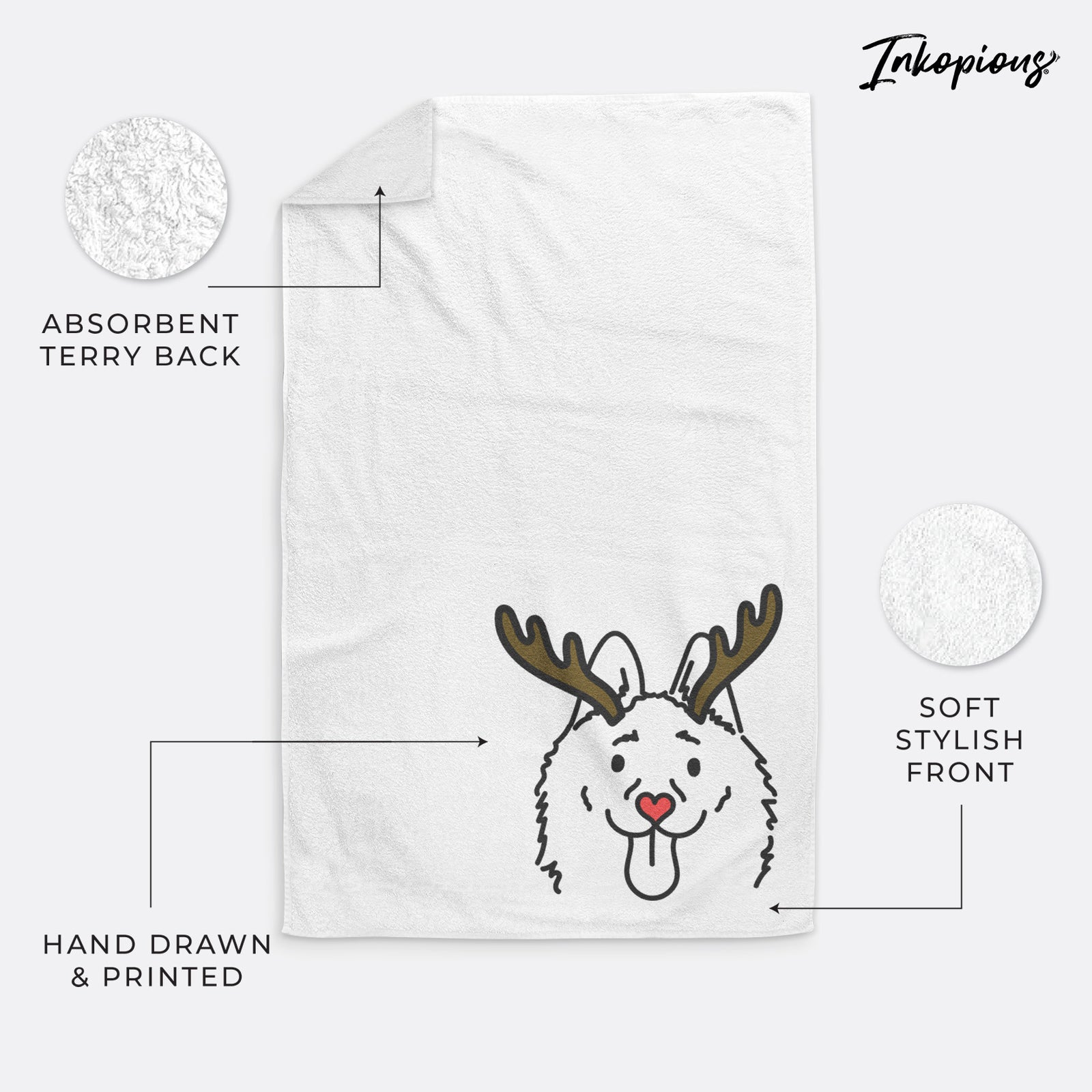 Minimalist line drawing of Meeko the Schipperke with reindeer antlers and a red nose on a decorative hand towel