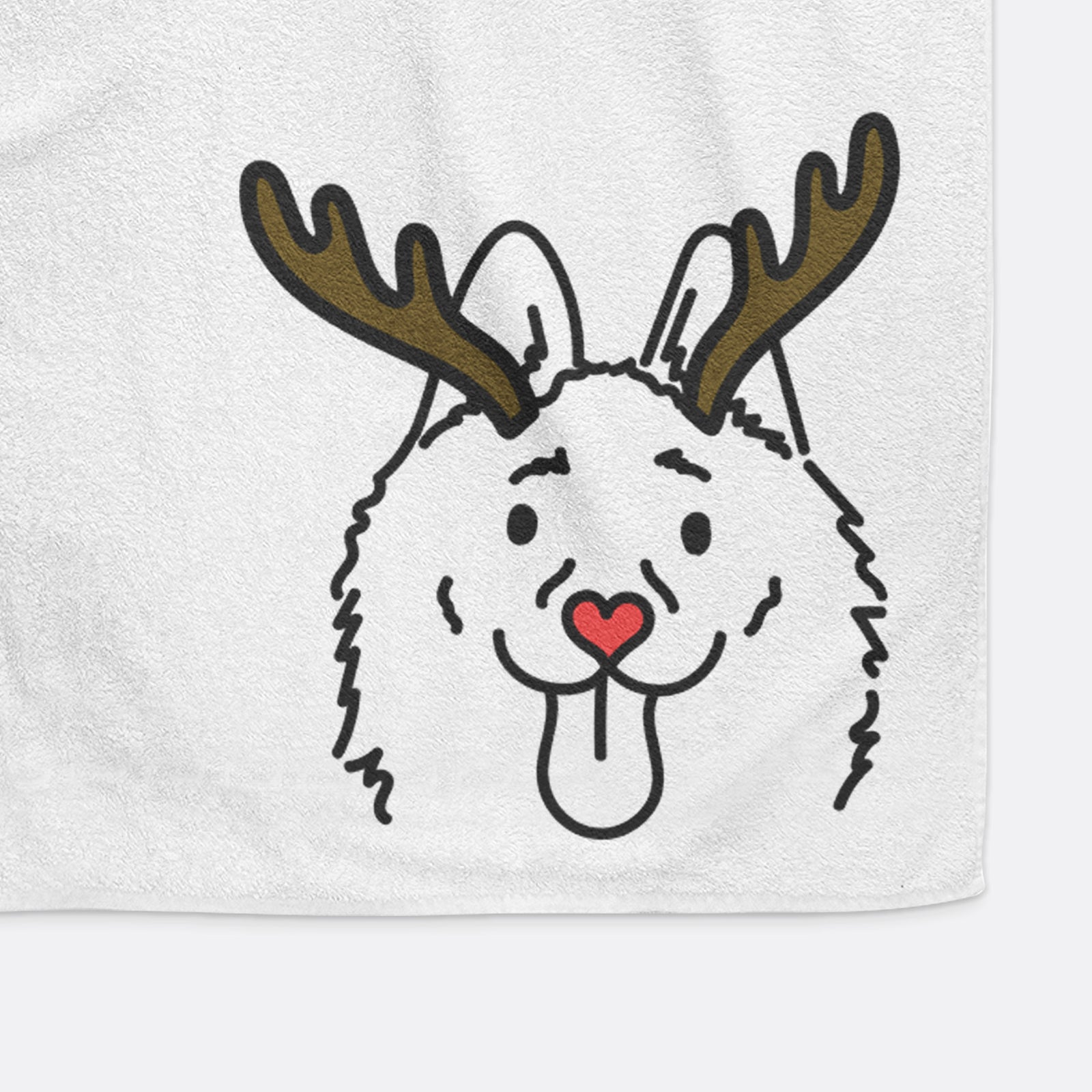 Minimalist line drawing of Meeko the Schipperke with reindeer antlers and a red nose on a decorative hand towel