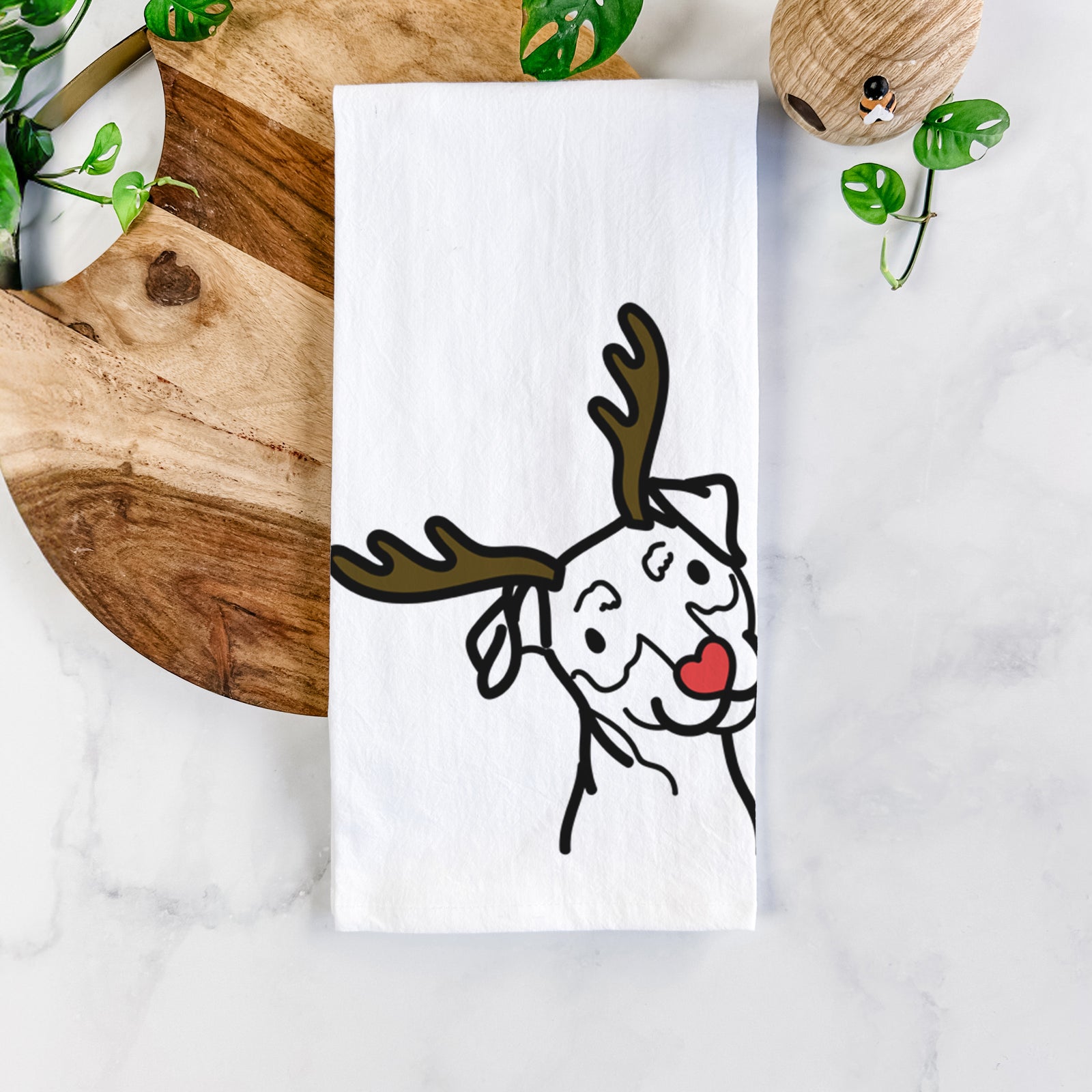 Minimalist line drawing of a Mini Pinscher with reindeer antlers and a red nose on a tea towel