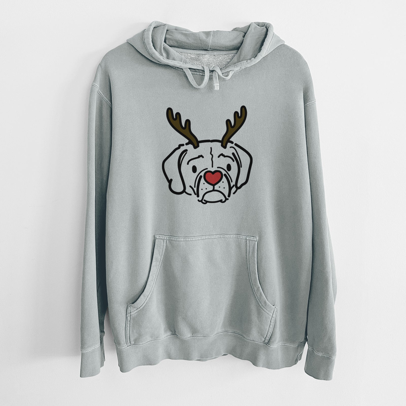 Minimalist line drawing of Mitzi the Puggle with reindeer antlers and a red nose on a Sage Unisex pigment dyed hoodie