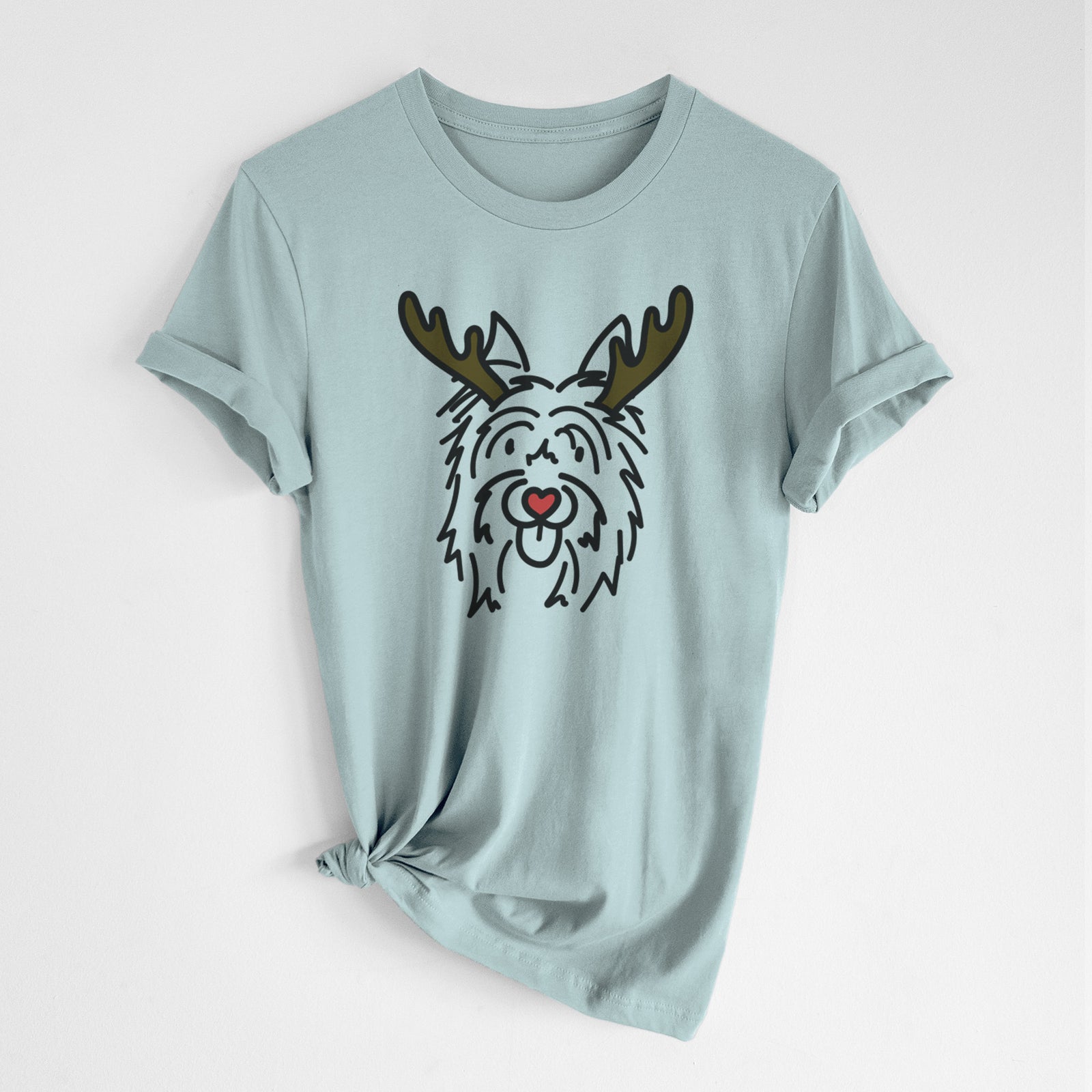 Minimalist line drawing of Monty the Silky Terrier with reindeer antlers and a red nose on a Dusty Blue Unisex crewneck, worn by a woman