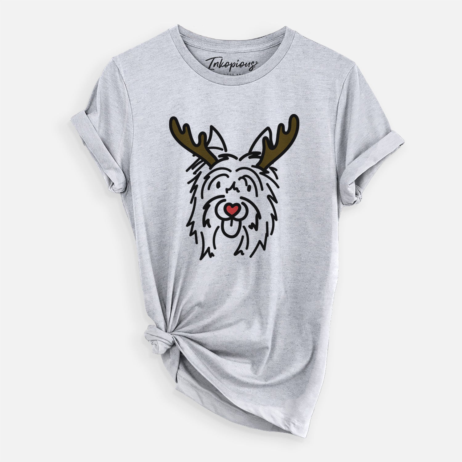 Minimalist line drawing of Monty the Silky Terrier with reindeer antlers and a red nose on a Grey Unisex crewneck, worn by a woman