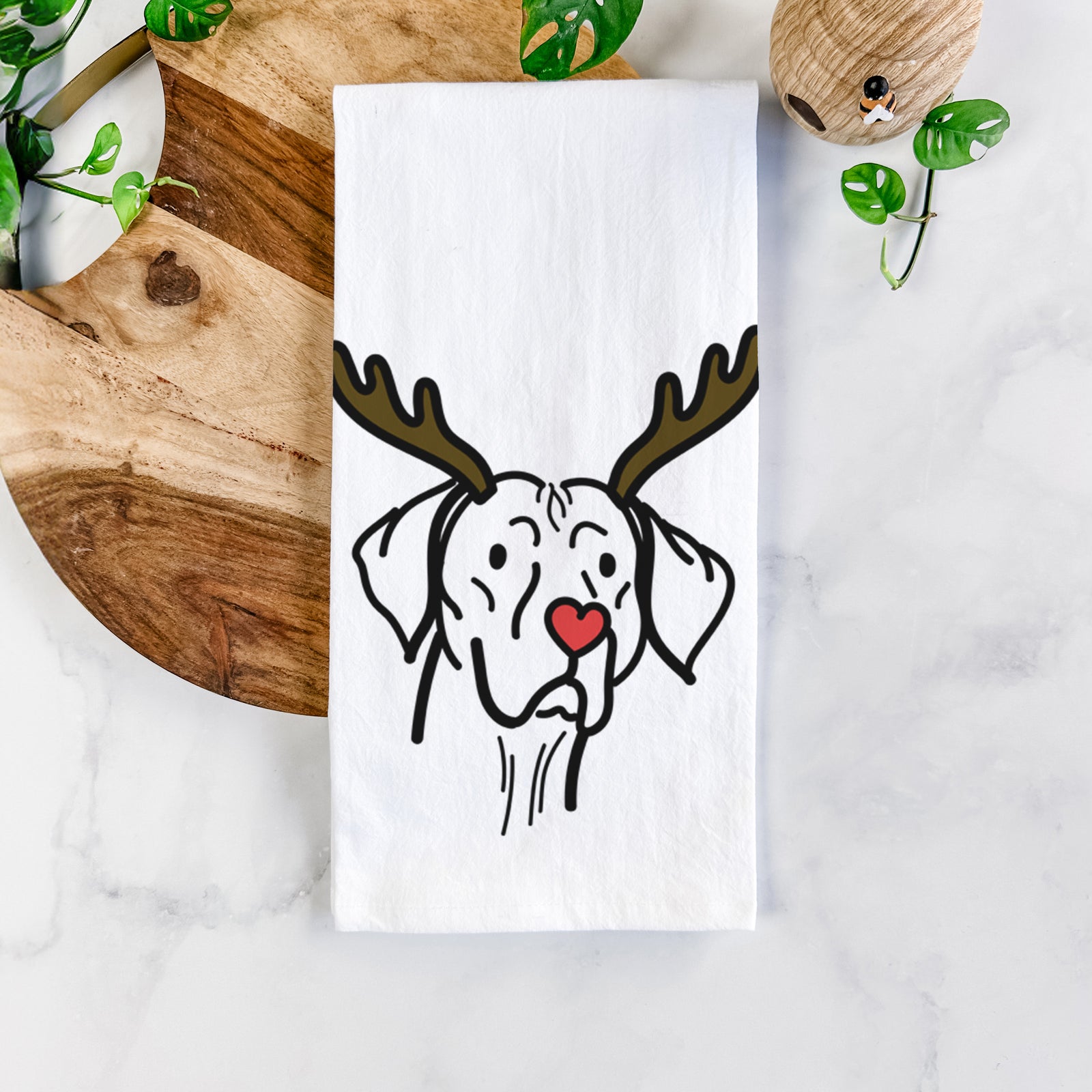 Minimalist line drawing of Moose the Vizsla with reindeer antlers and a red nose on a tea towel