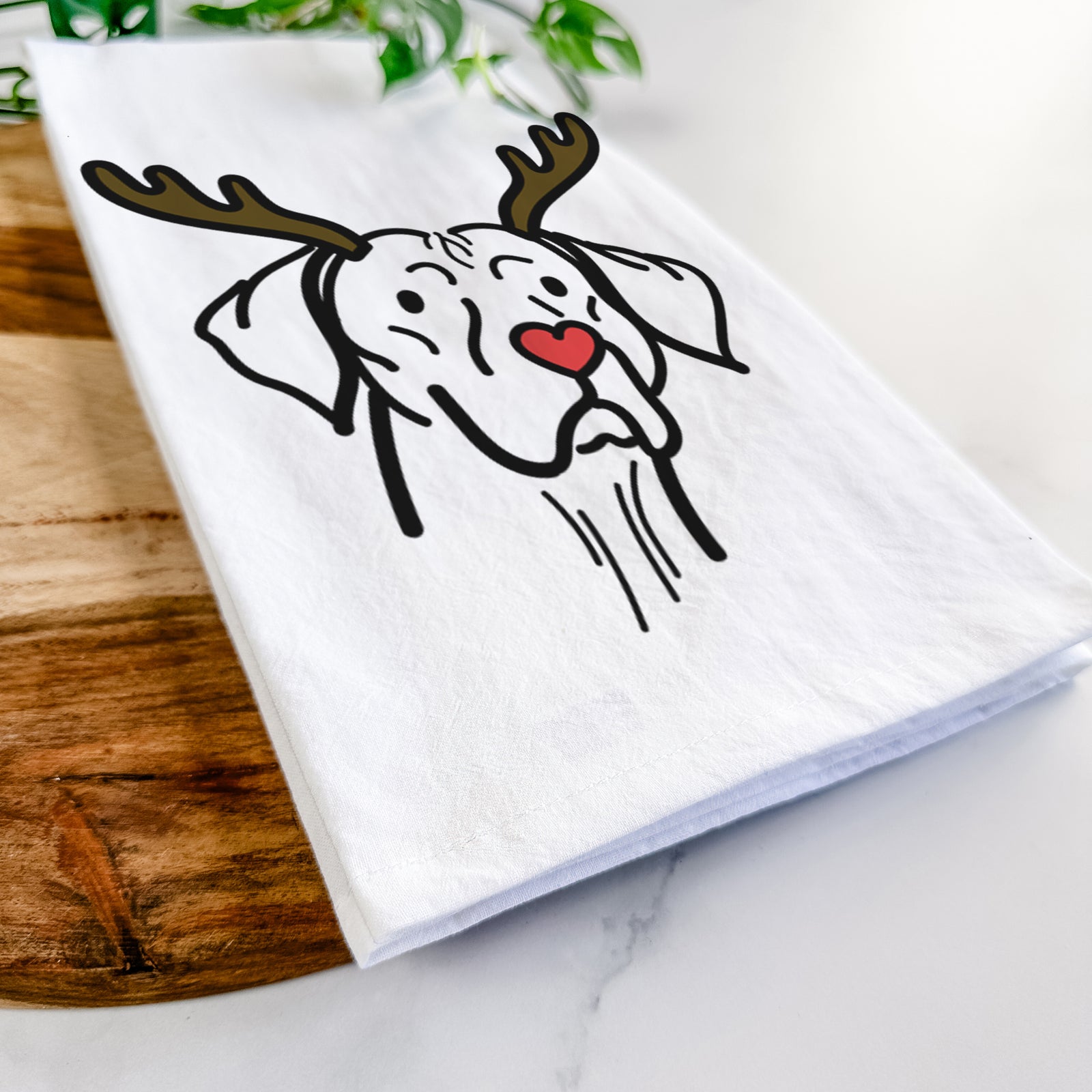 Minimalist line drawing of Moose the Vizsla with reindeer antlers and a red nose on a tea towel