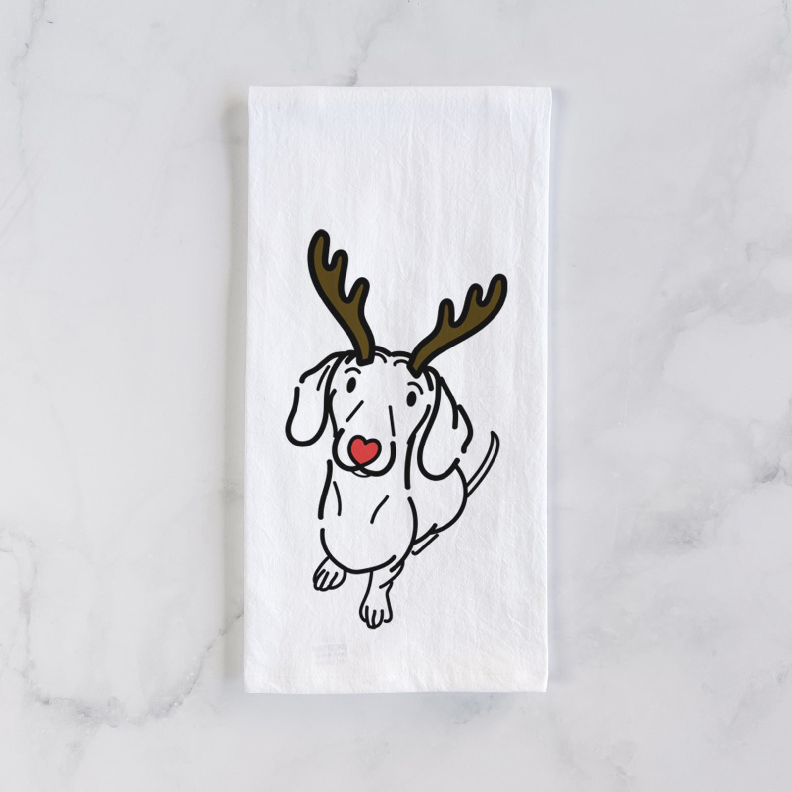 Minimalist line drawing of Moxie the Dachshund with reindeer antlers and a red nose on a tea towel