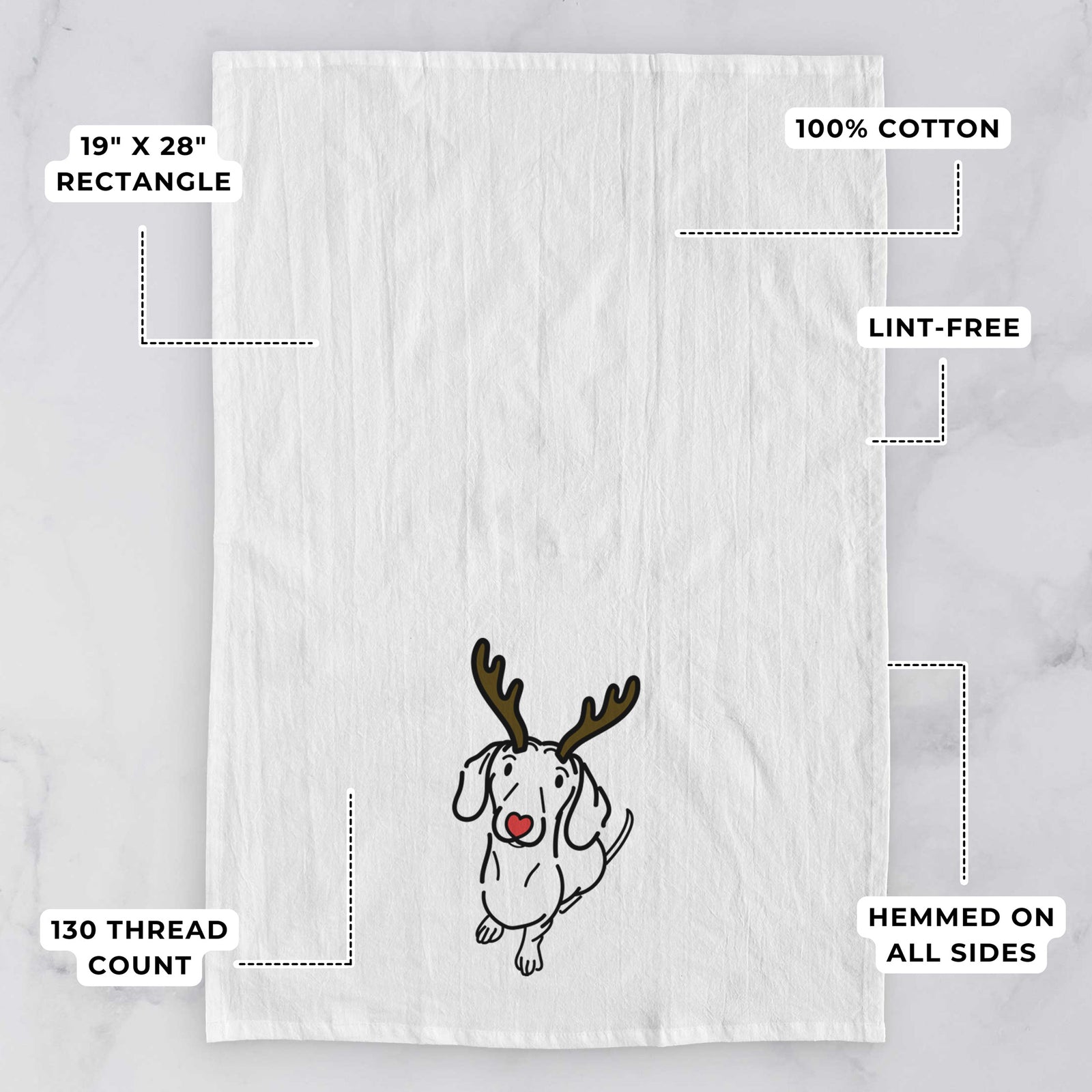 Minimalist line drawing of Moxie the Dachshund with reindeer antlers and a red nose on a tea towel, with feature callouts: 19 x 28 inch rectangle, 100% cotton, lint-free, 120 thread count, hemmed on all sides