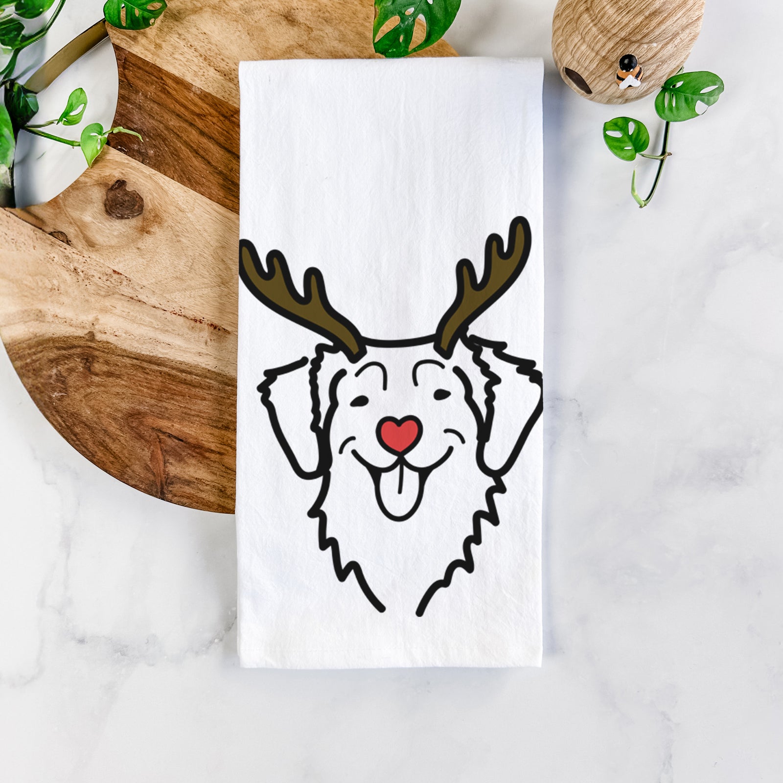Minimalist line drawing of a Nova Scotia Duck Tolling Retriever with reindeer antlers and a red nose on a tea towel