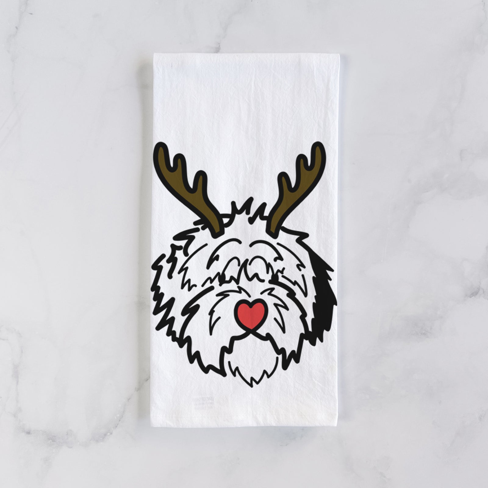 Minimalist line drawing of Penny the Old English Sheepdog with reindeer antlers and a red nose on a tea towel