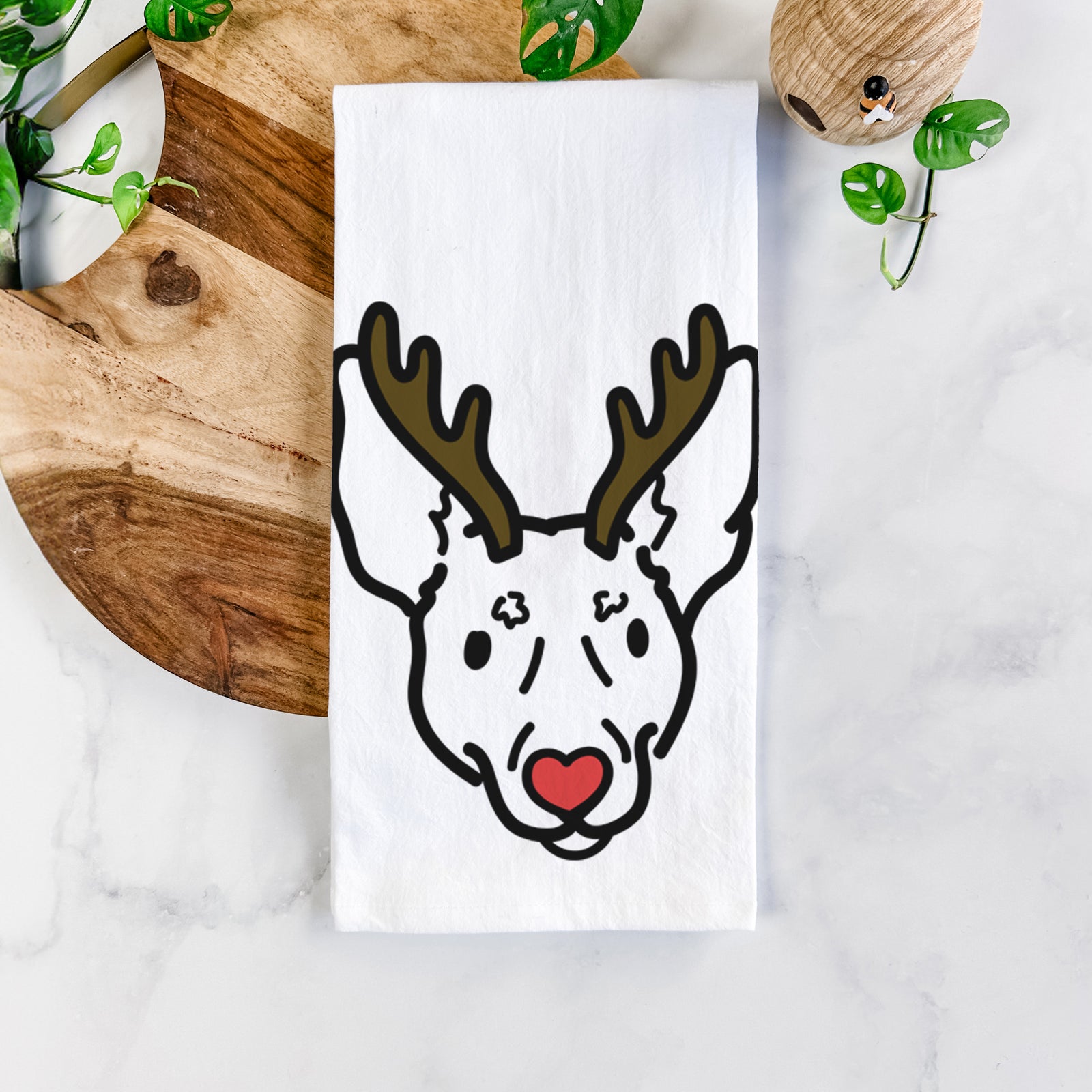 Minimalist line drawing of Penny the Rat Terrier with reindeer antlers and a red nose on a tea towel
