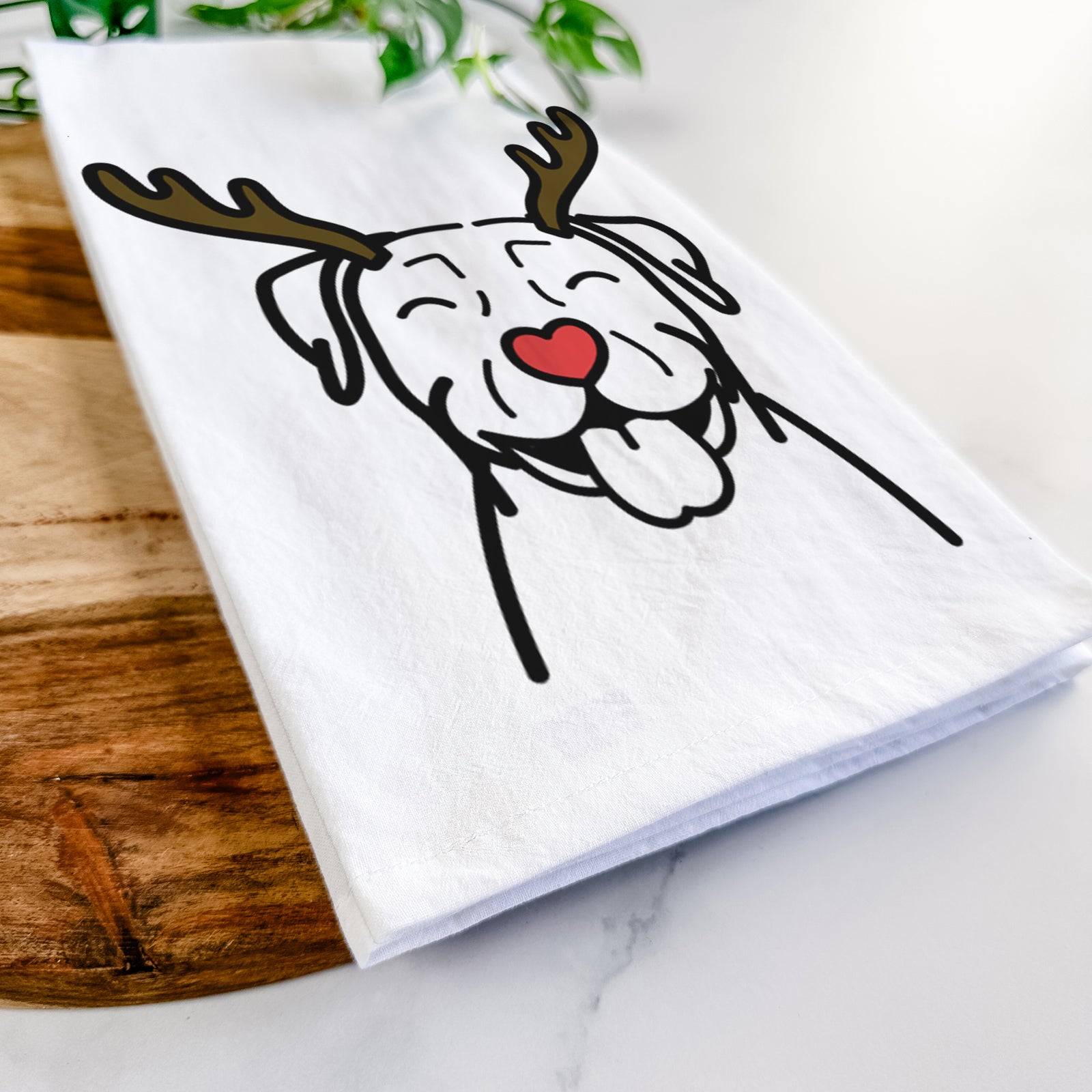 Minimalist line drawing of a Pitbull with reindeer antlers and a red nose on a tea towel