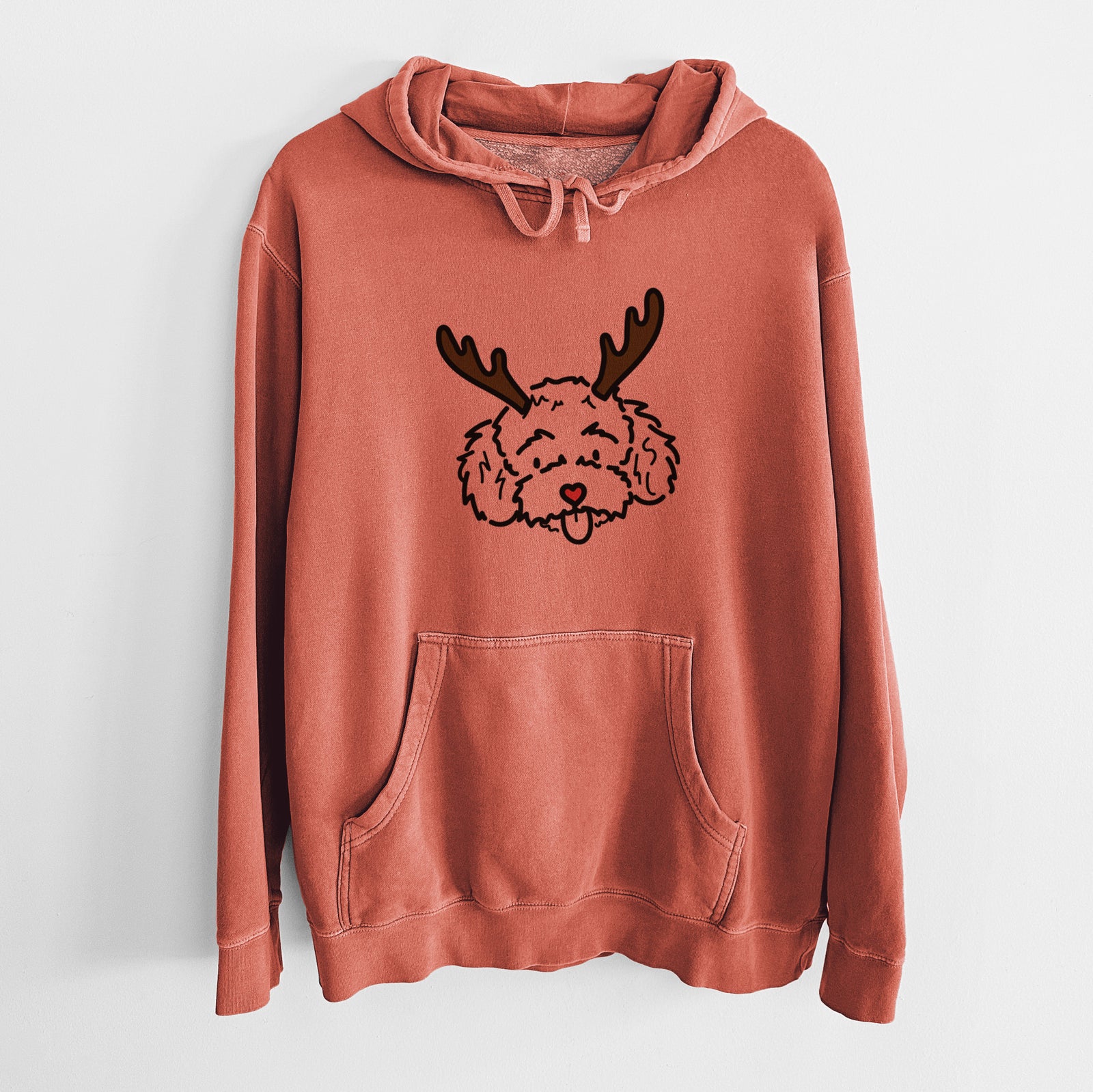 Minimalist line drawing of Ricci the Toy Poodle with reindeer antlers and a red nose on an Amber Unisex pigment dyed hoodie
