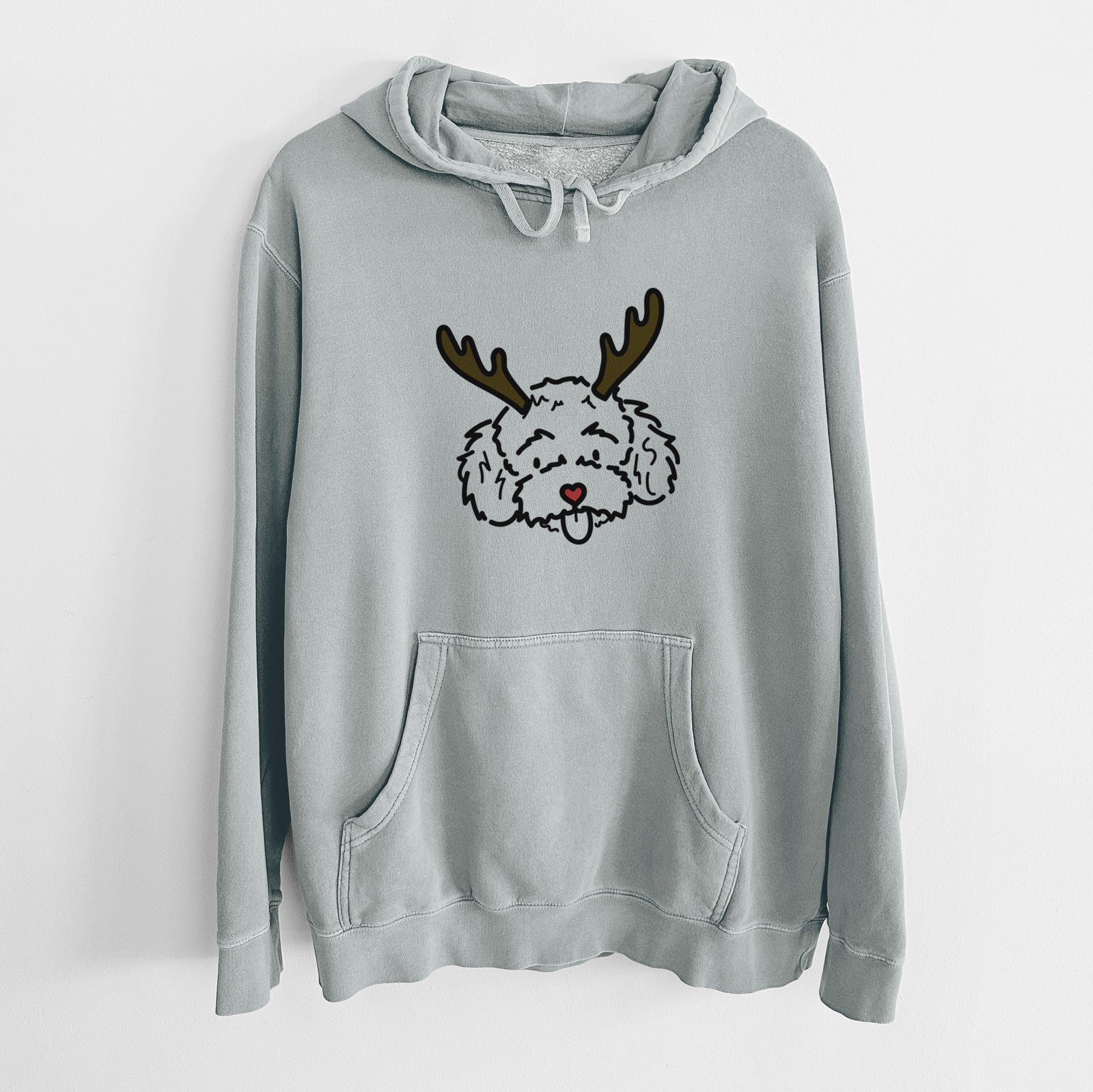 Minimalist line drawing of Ricci the Toy Poodle with reindeer antlers and a red nose on a Sage Unisex pigment dyed hoodie