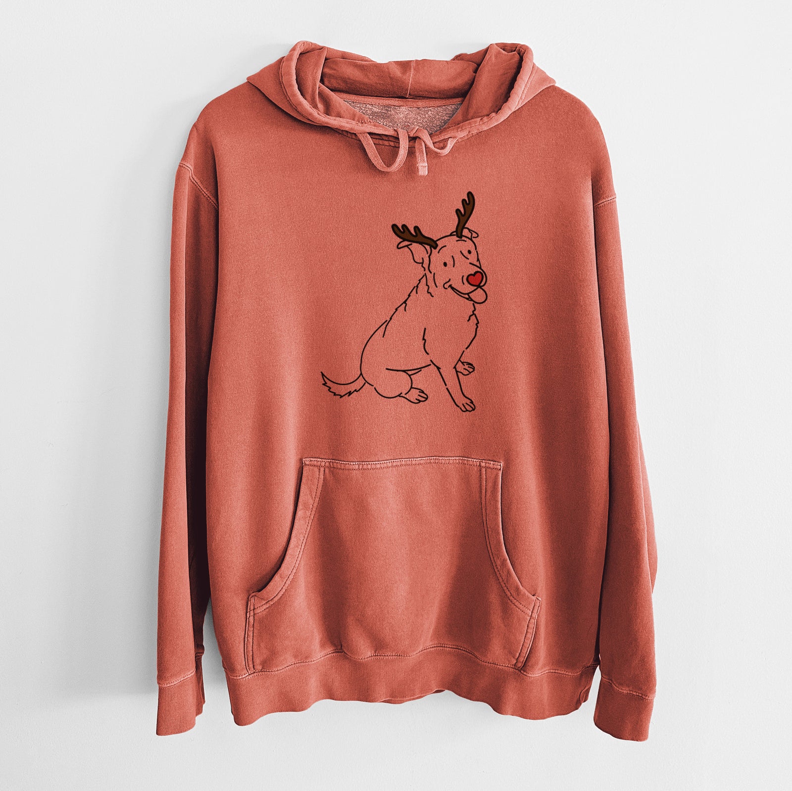 Minimalist line drawing of Rocky the Rottweiler Mix with reindeer antlers and a red nose on an Amber Unisex pigment dyed hoodie