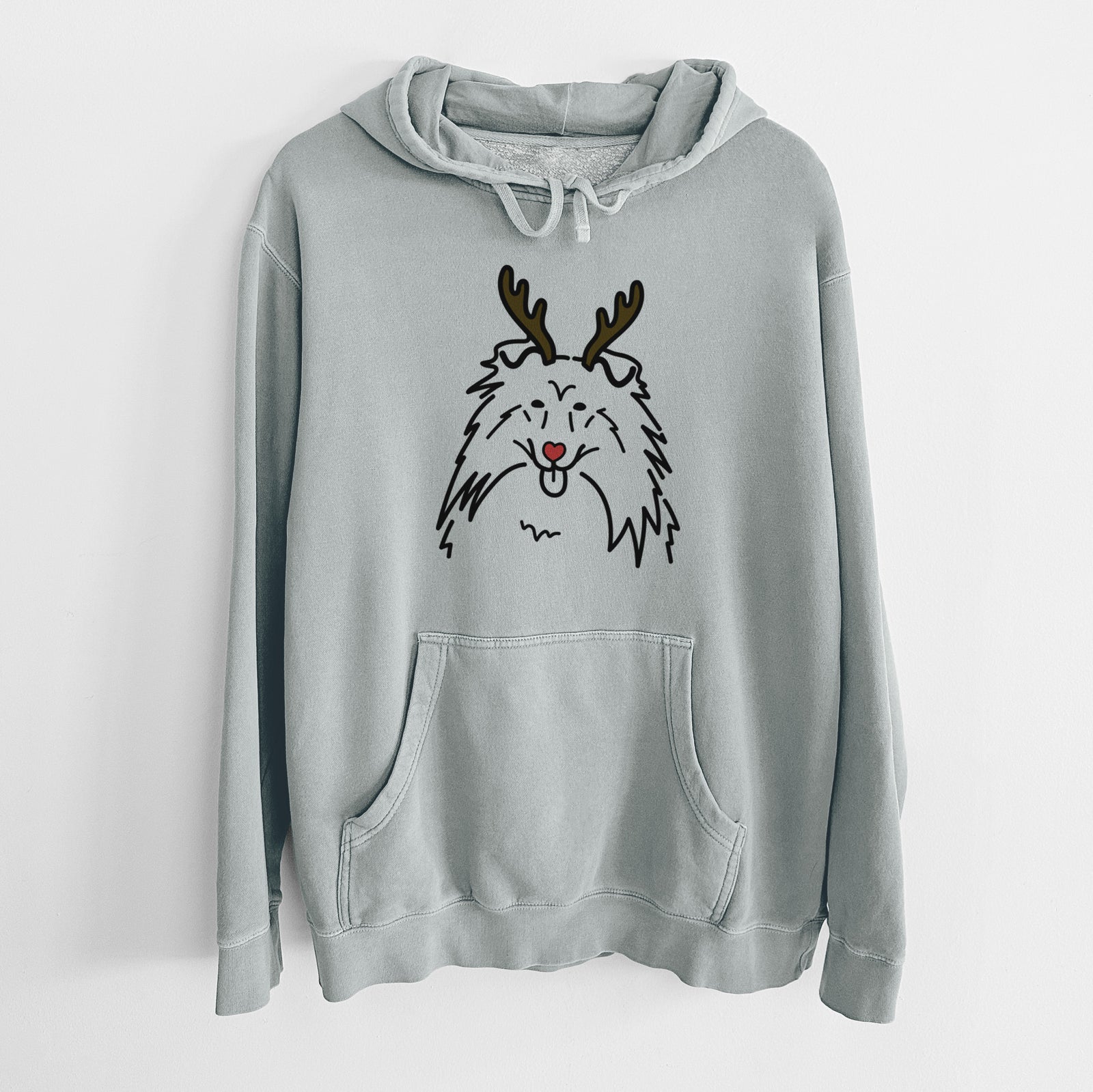 Minimalist line drawing of a Rough Collie with reindeer antlers and a red nose on a Sage Unisex pigment dyed hoodie