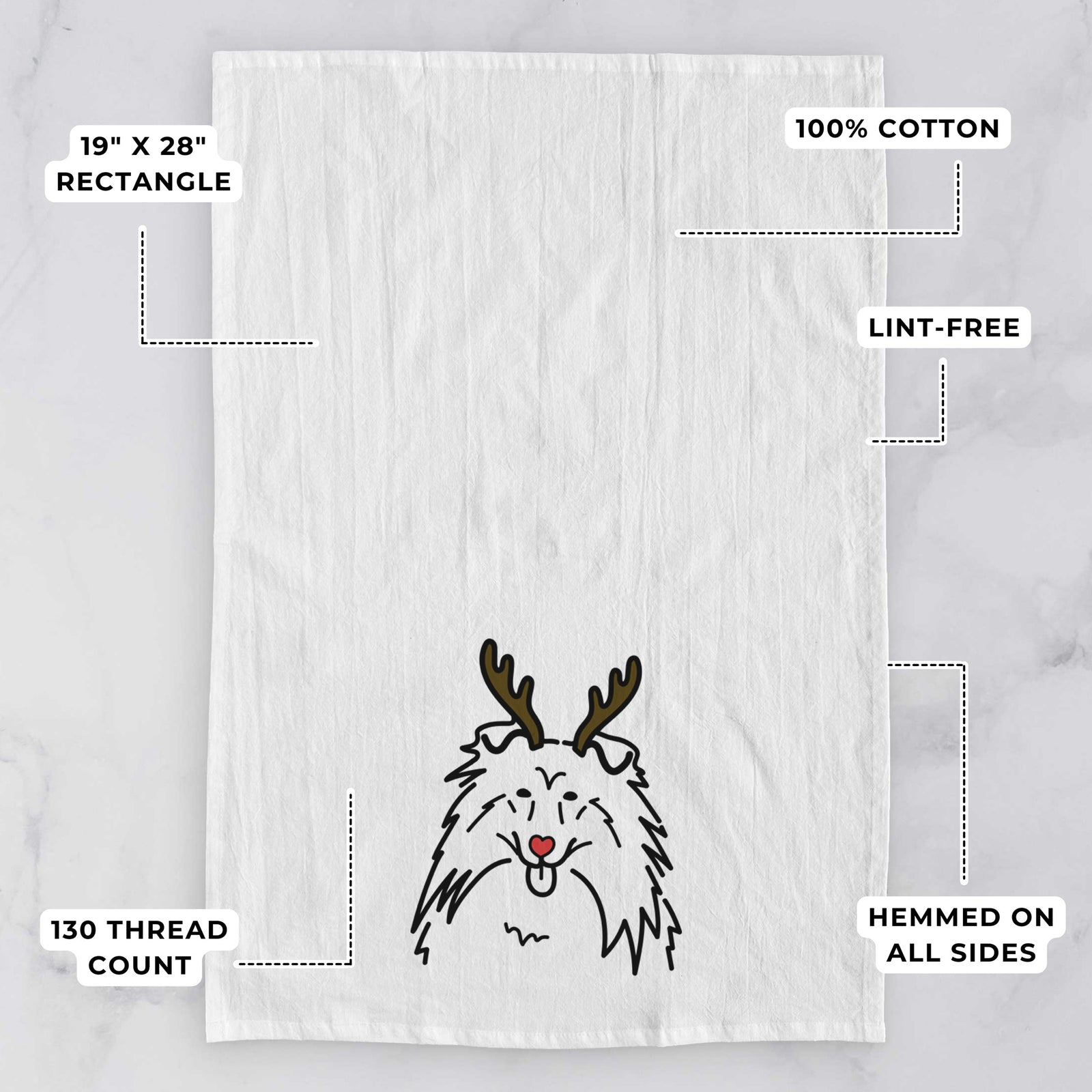 Minimalist line drawing of a Rough Collie with reindeer antlers and a red nose on a tea towel, with feature callouts: 19 x 28 inch rectangle, 100% cotton, lint-free, 120 thread count, hemmed on all sides