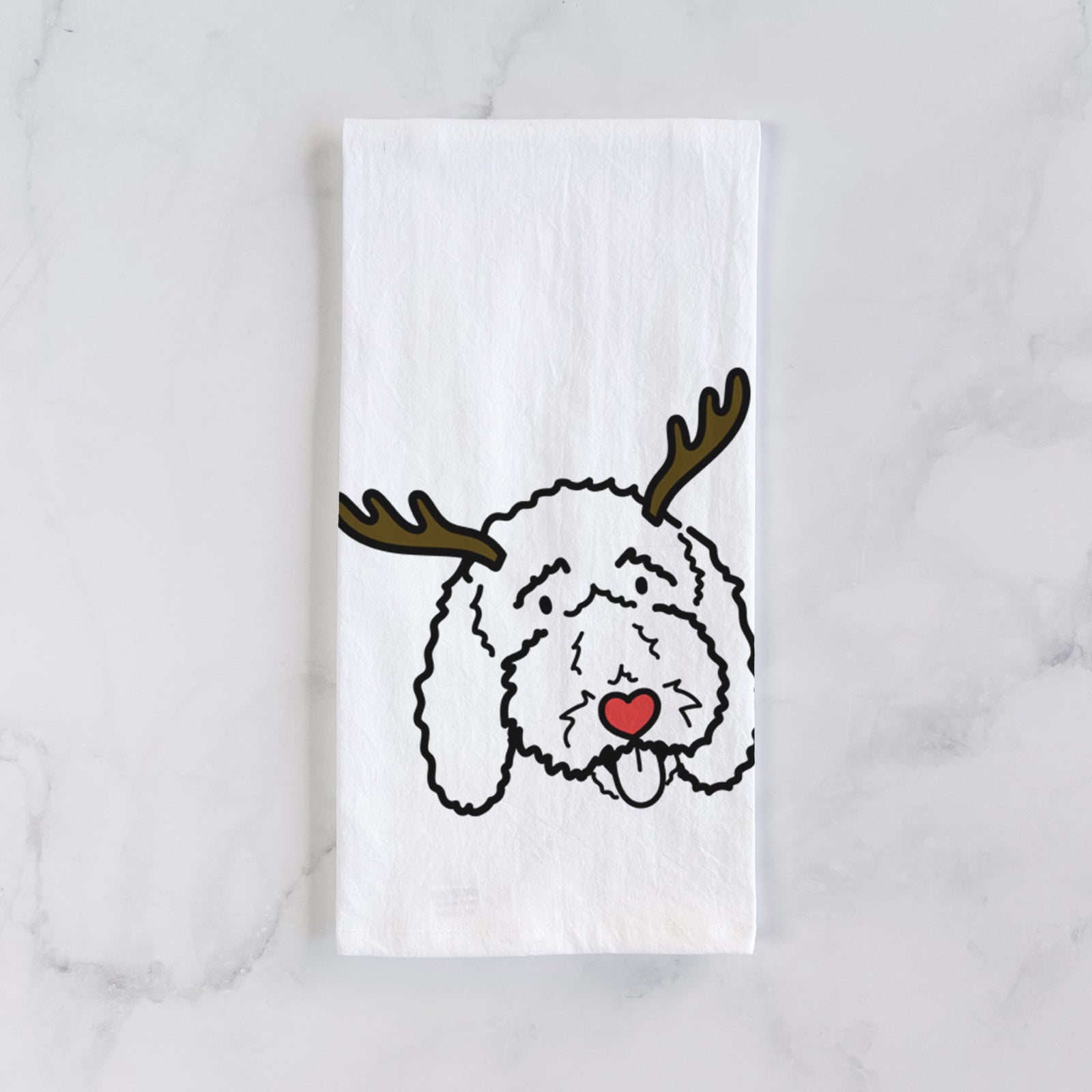 Minimalist line drawing of Ruby the Bernedoodle with reindeer antlers and a red nose on a tea towel