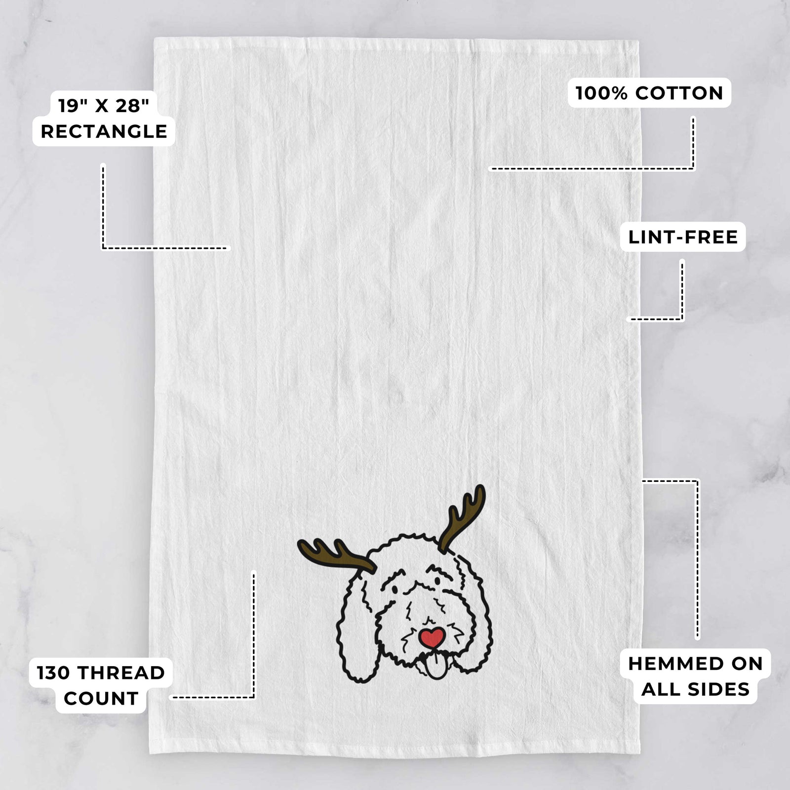Minimalist line drawing of Ruby the Bernedoodle with reindeer antlers and a red nose on a tea towel, with feature callouts: 19 x 28 inch rectangle, 100% cotton, lint-free, 120 thread count, hemmed on all sides